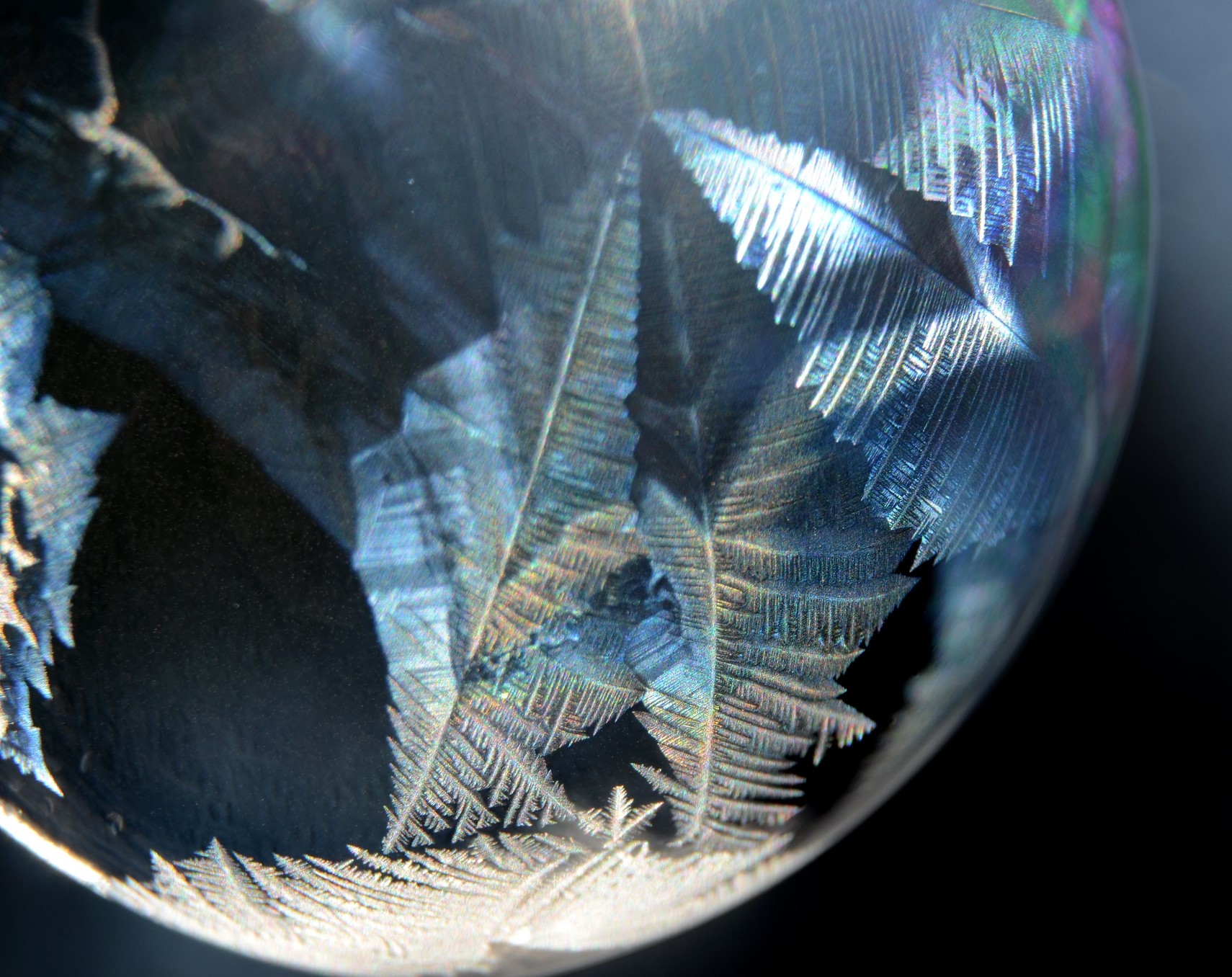 Macro view of ice crystals forming on a frozen bubble HD Wallpaper