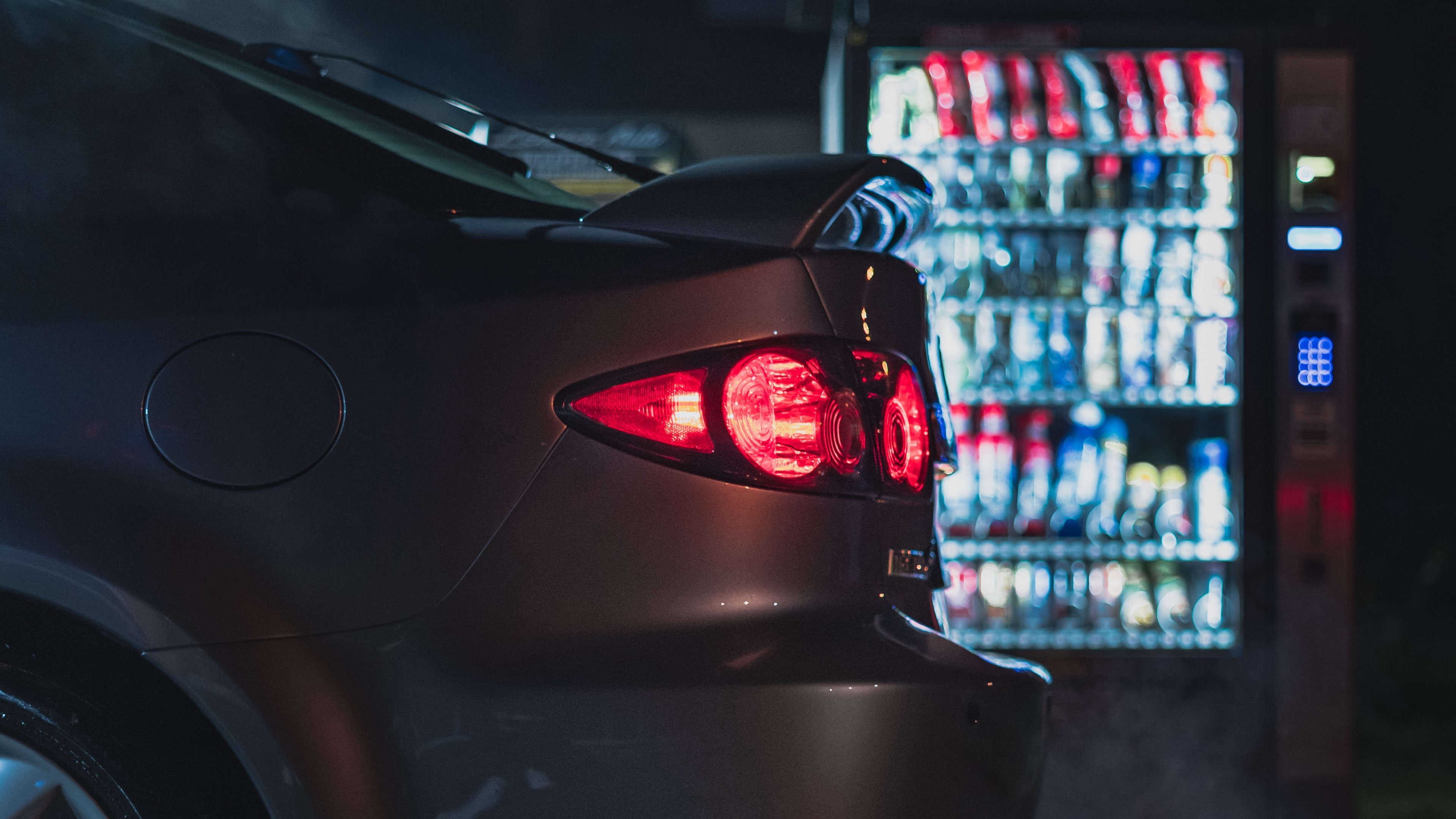 4K Gray Mazda 3 Taillights and Vending Machine at Night HD Wallpaper