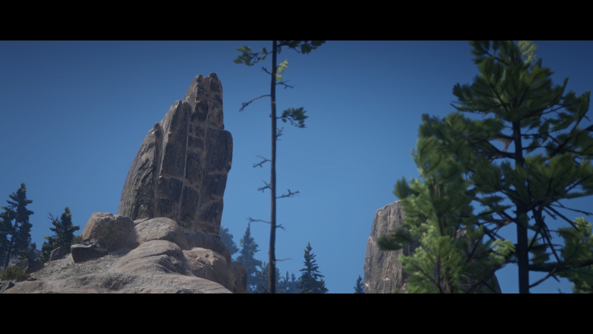 Red Dead Redemption 2 rocky landscape with pine trees HD Wallpaper