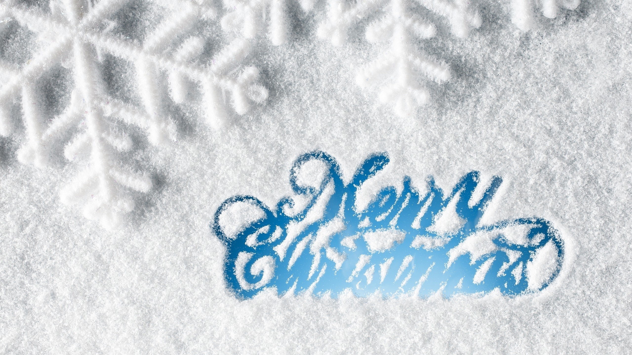 Merry Christmas text in snow with snowflakes HD Wallpaper