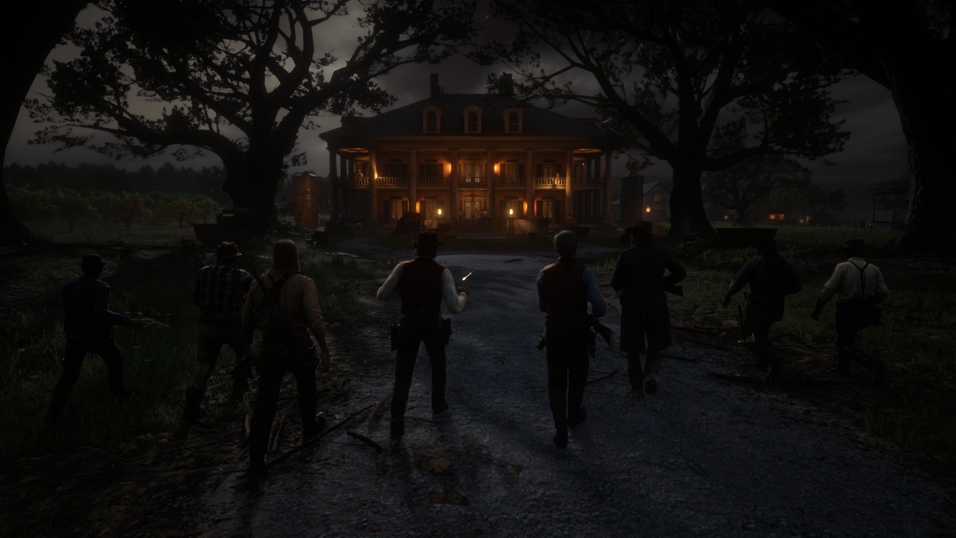 Group of men approaching a large house at night in Red Dead Redemption 2 HD Wallpaper