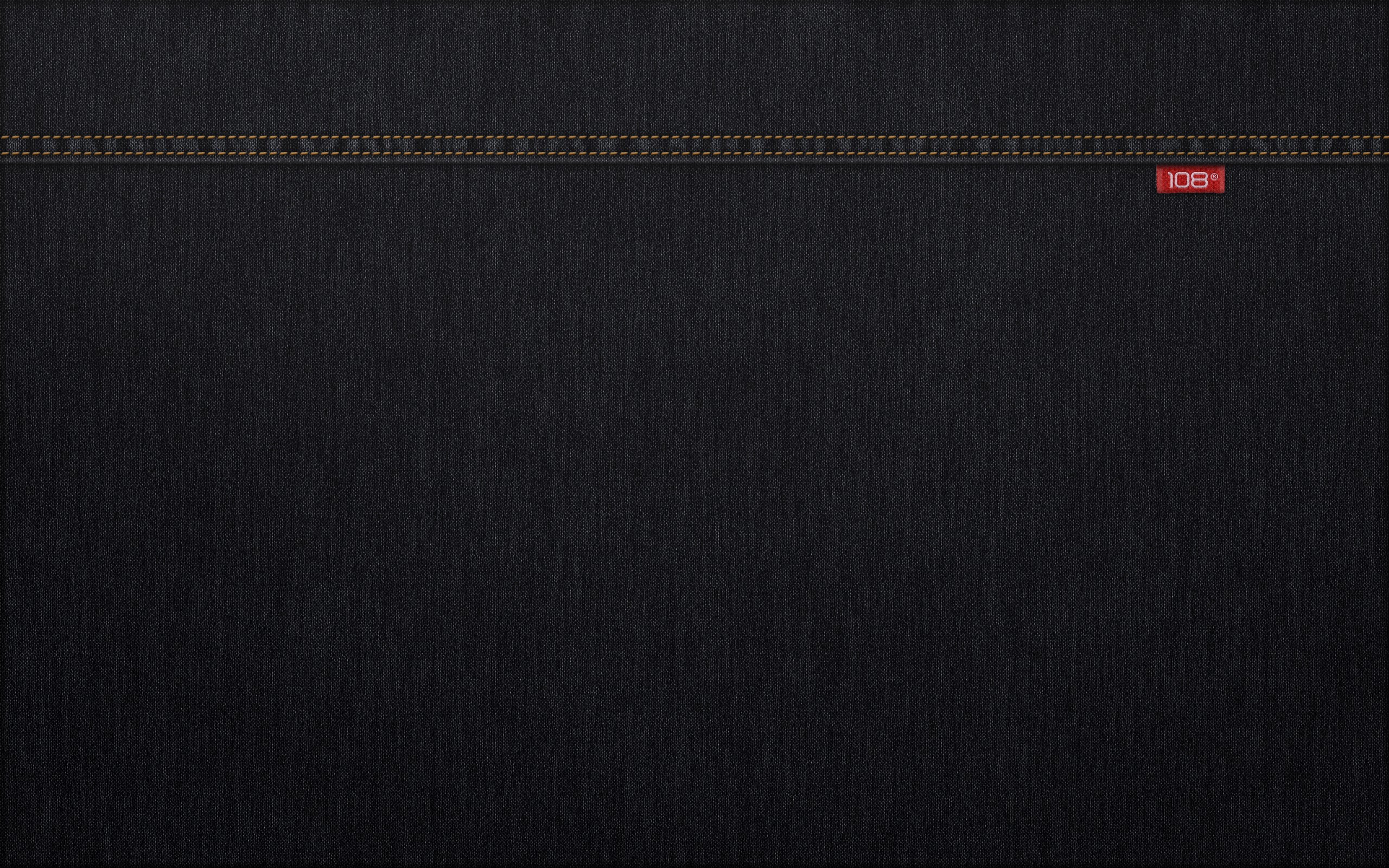 Black denim with stitching and red "108" label HD Wallpaper