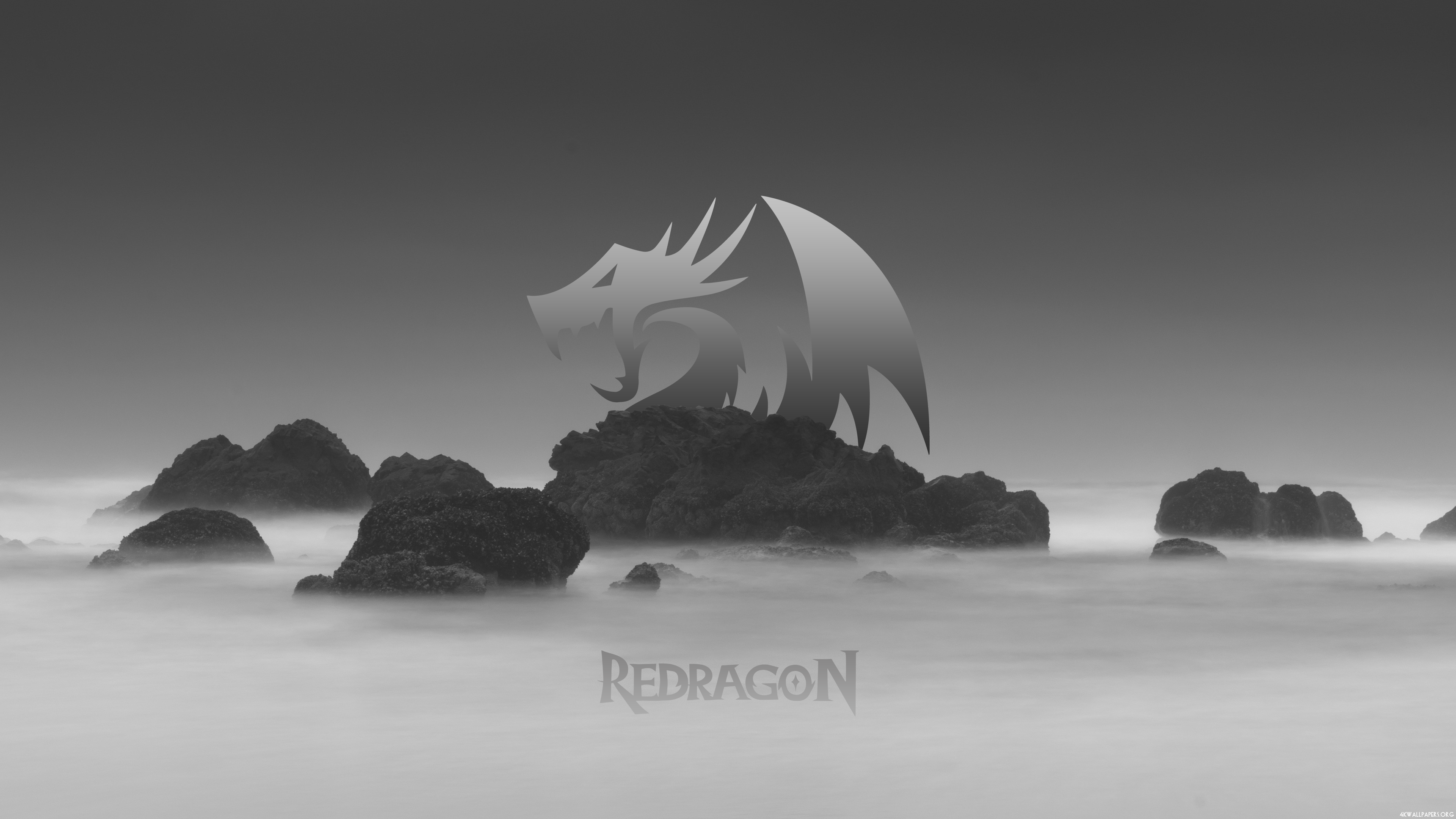 Redragon logo over rocky islands in fog HD Wallpaper