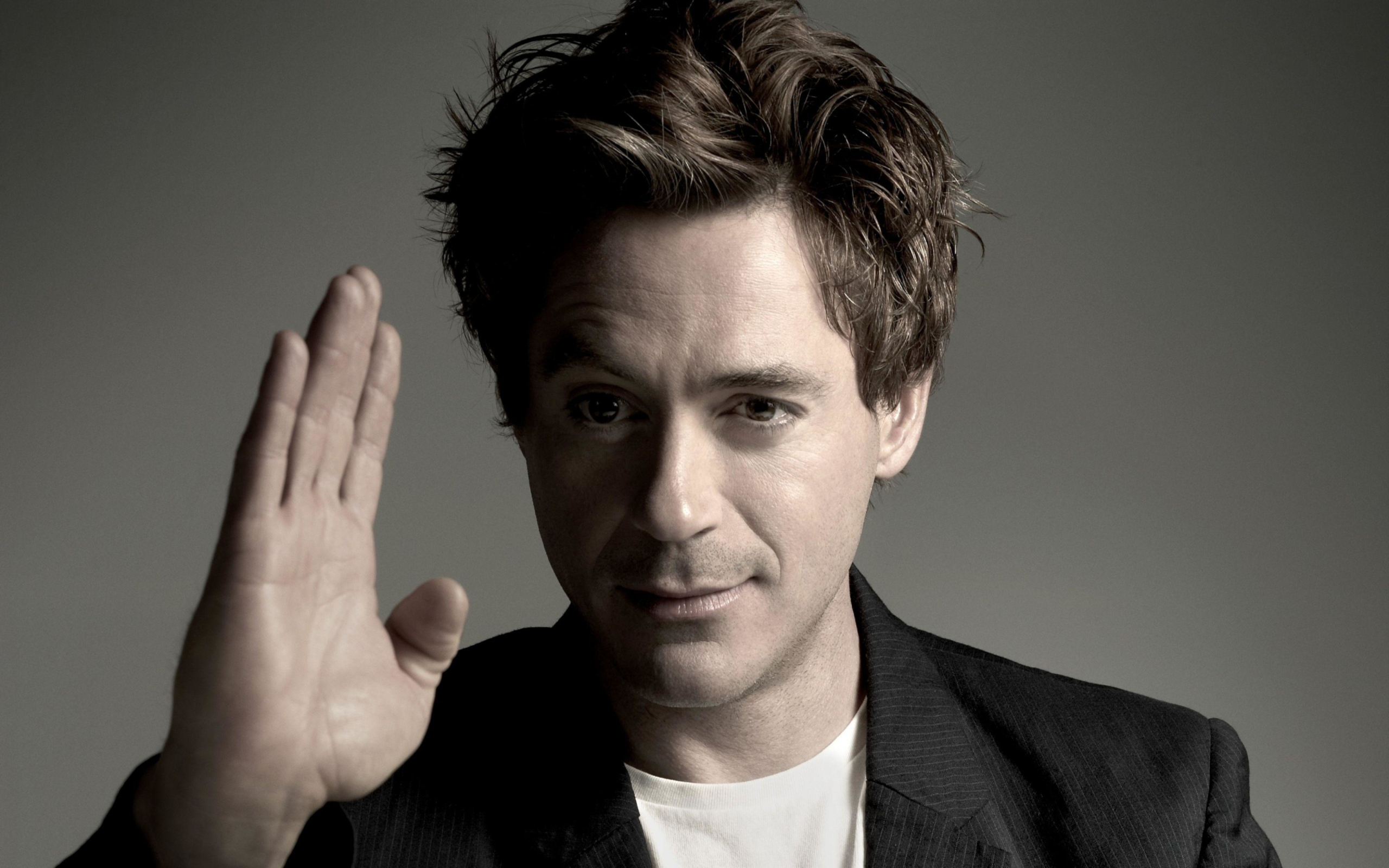 Robert Downey Jr. raises his hand HD Wallpaper