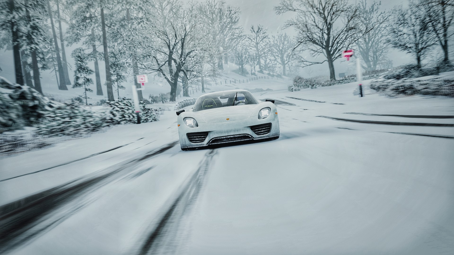 Porsche 918 Spyder driving on a snowy road HD Wallpaper