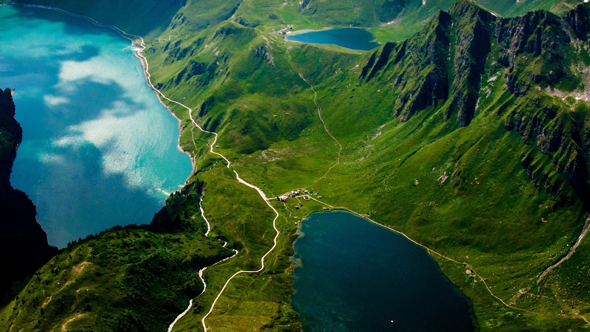 Aerial view of lakes and mountains in the Alps HD Wallpaper