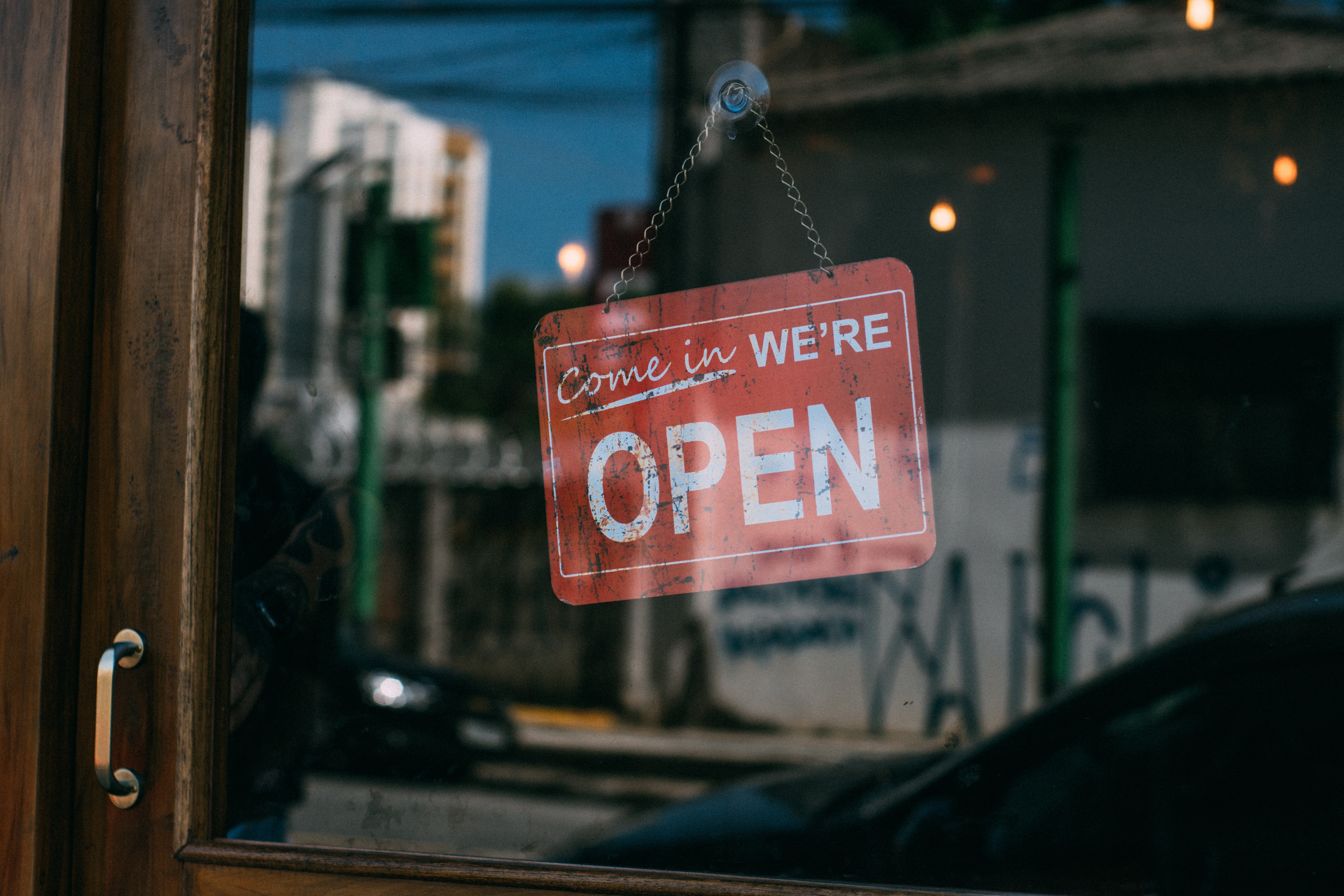 Open sign hanging on a glass door HD Wallpaper