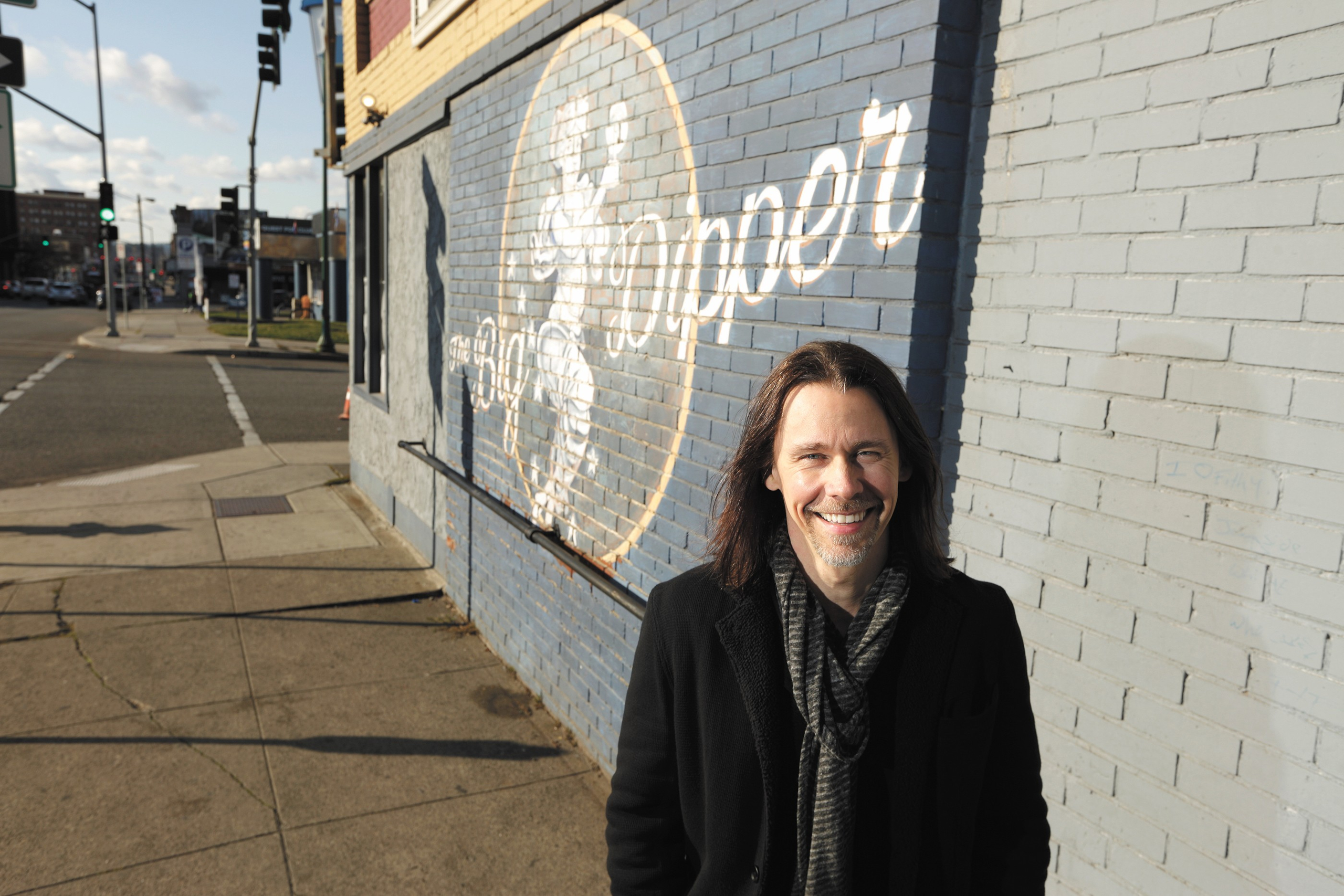 Myles Kennedy smiles in front of a mural HD Wallpaper