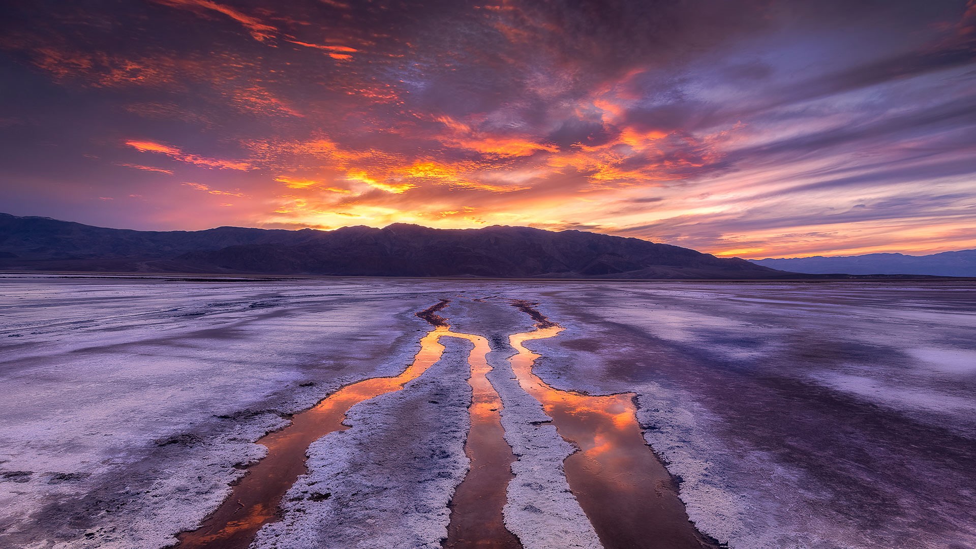 Sunset over Death Valley salt flats with mountain range HD Wallpaper