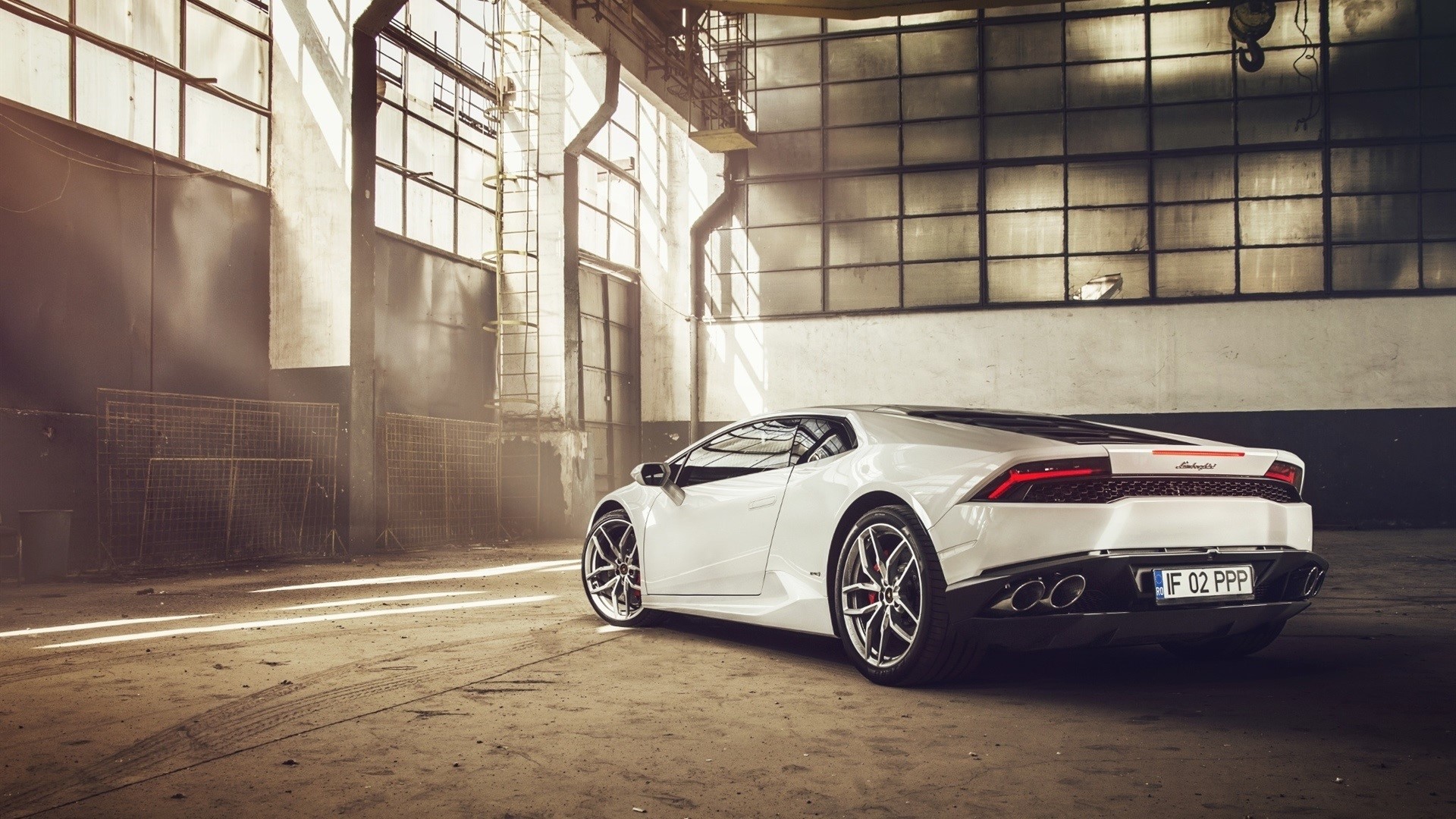White Lamborghini Huracan in an industrial garage HD Wallpaper