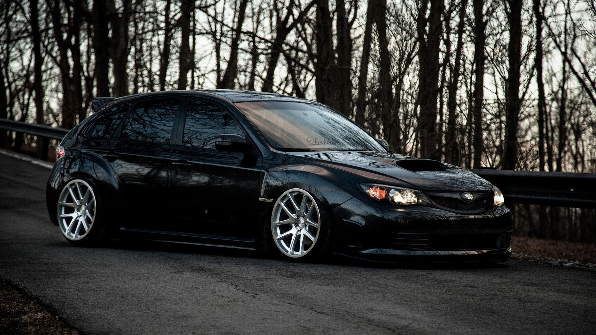 Black Subaru Impreza WRX STI parked on a road HD Wallpaper
