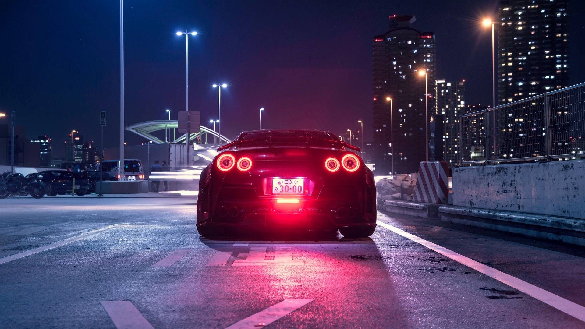 Nissan GT-R sports car at night in a city HD Wallpaper