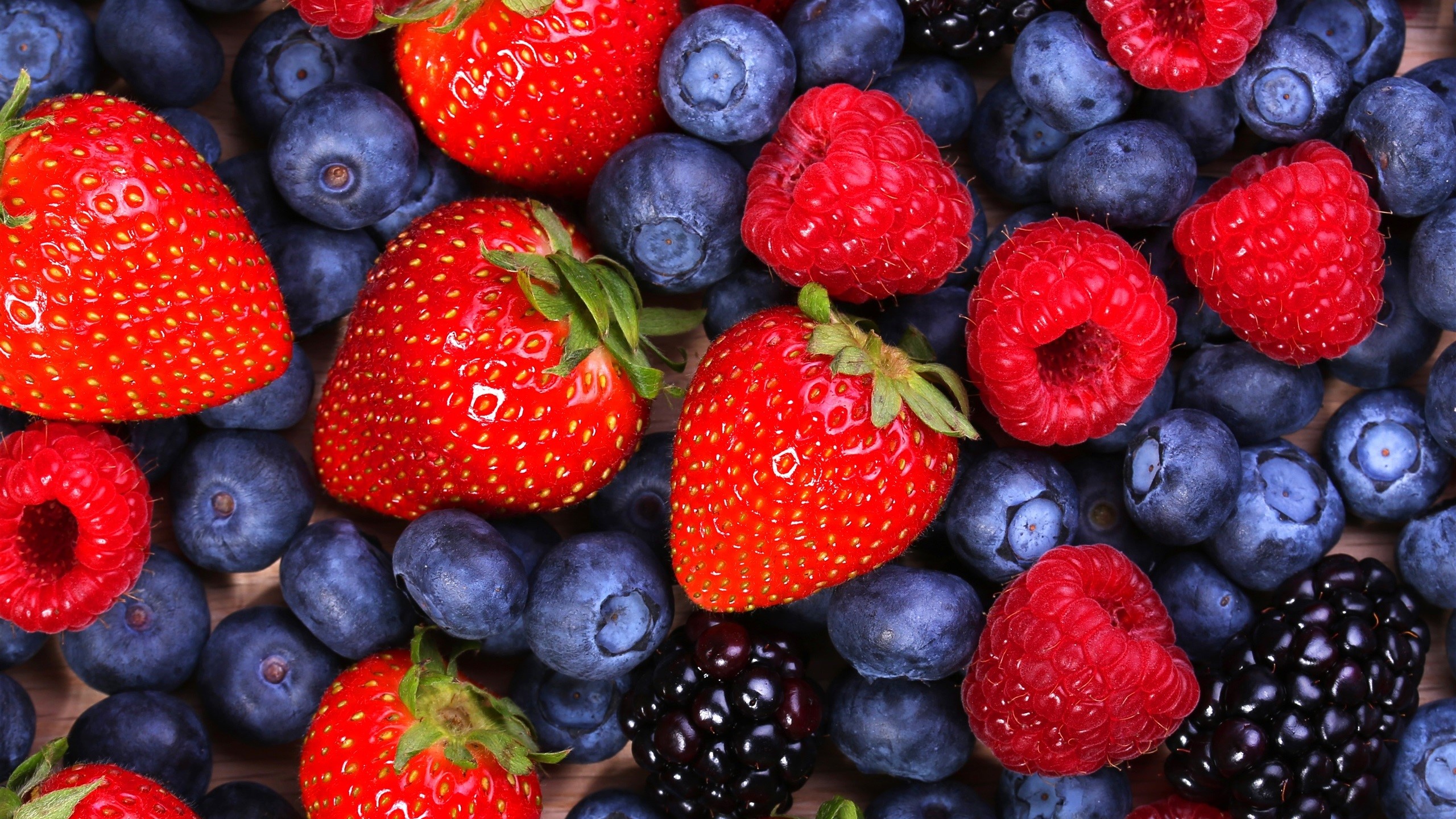 Assortment of fresh berries including strawberries, blueberries, raspberries, and blackberries HD Wallpaper