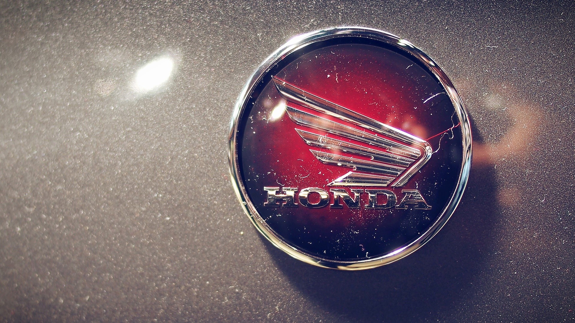 Honda logo emblem on a car HD Wallpaper