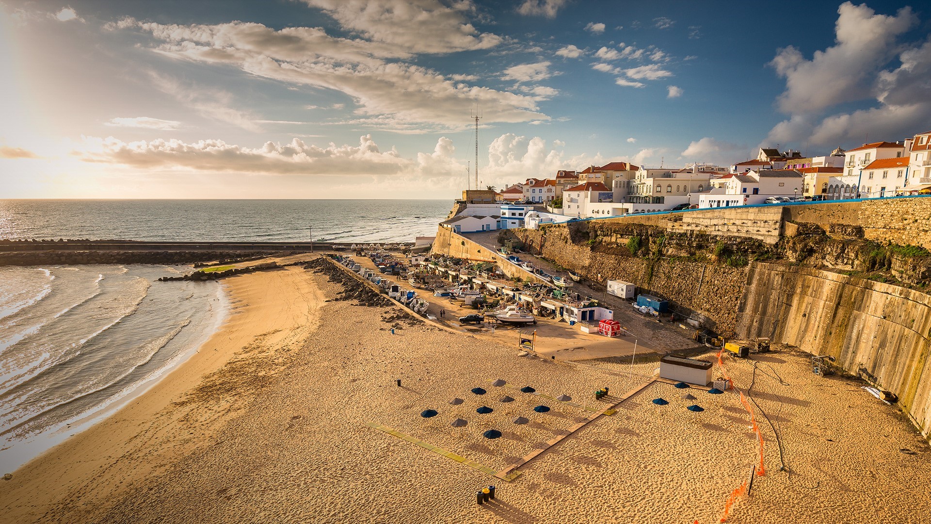Coastal town with beach and boats in Portugal HD Wallpaper
