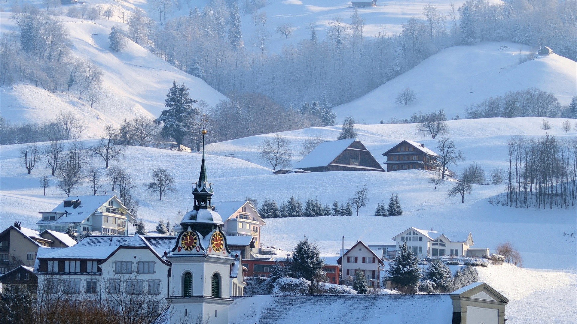 Snowy village with church tower and mountains HD Wallpaper