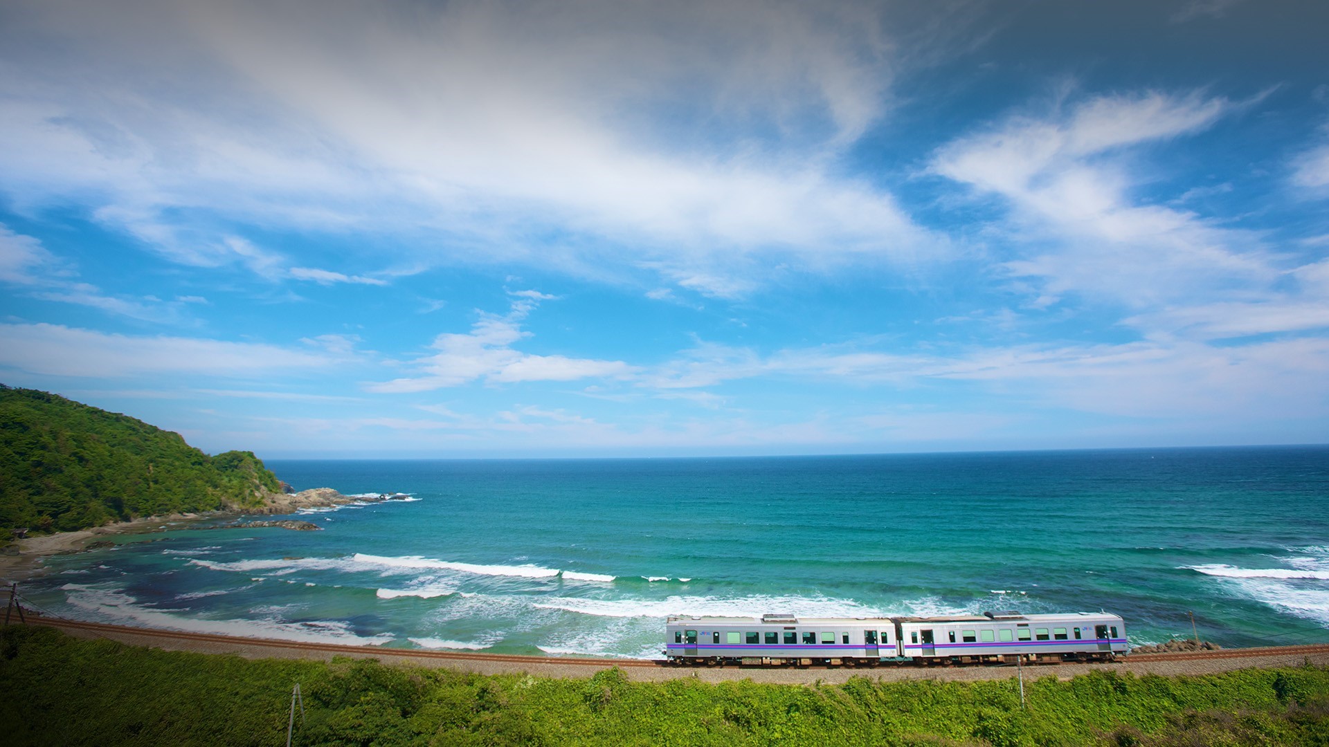 Train traveling along the coast in Shimane Prefecture, Japan HD Wallpaper
