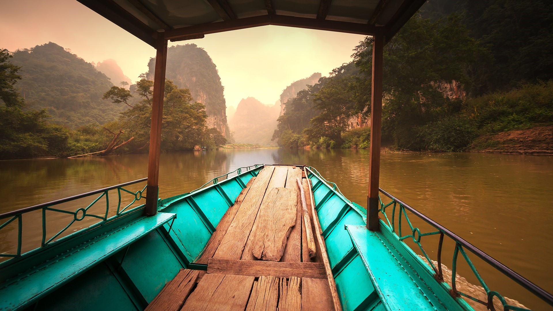 Boat on a river with mountains and mist in Vietnam HD Wallpaper
