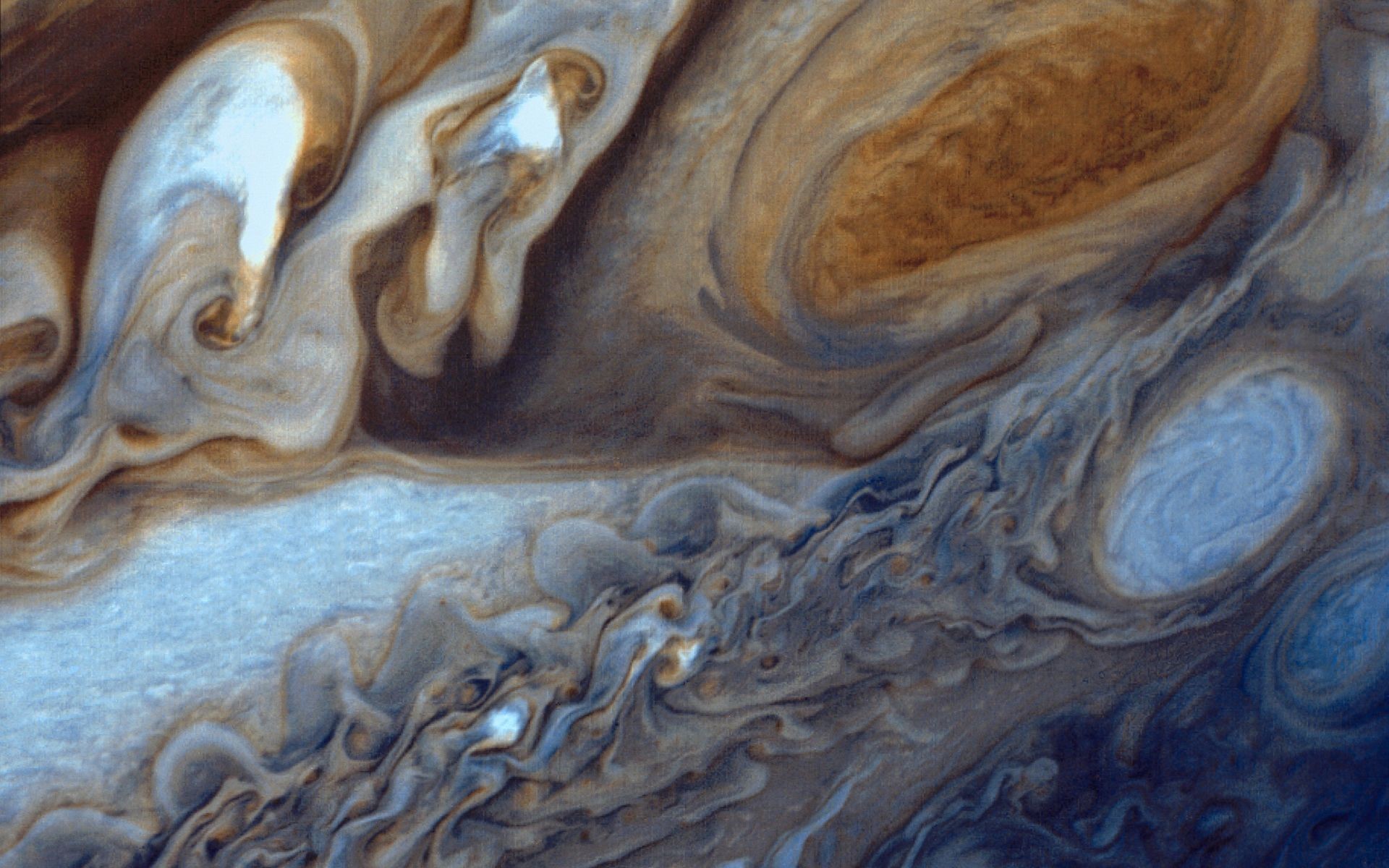 Jupiter's swirling clouds and storms HD Wallpaper