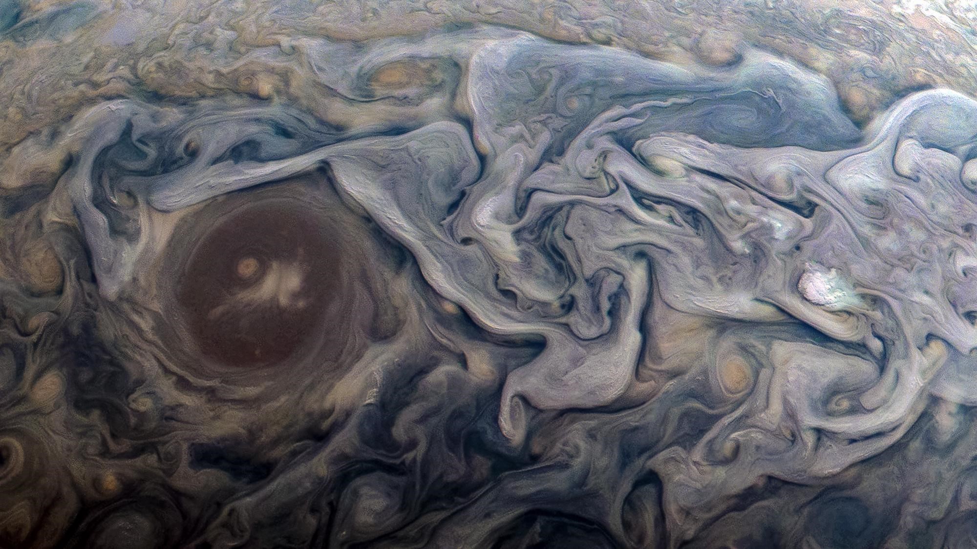 Jupiter's swirling clouds and storms HD Wallpaper