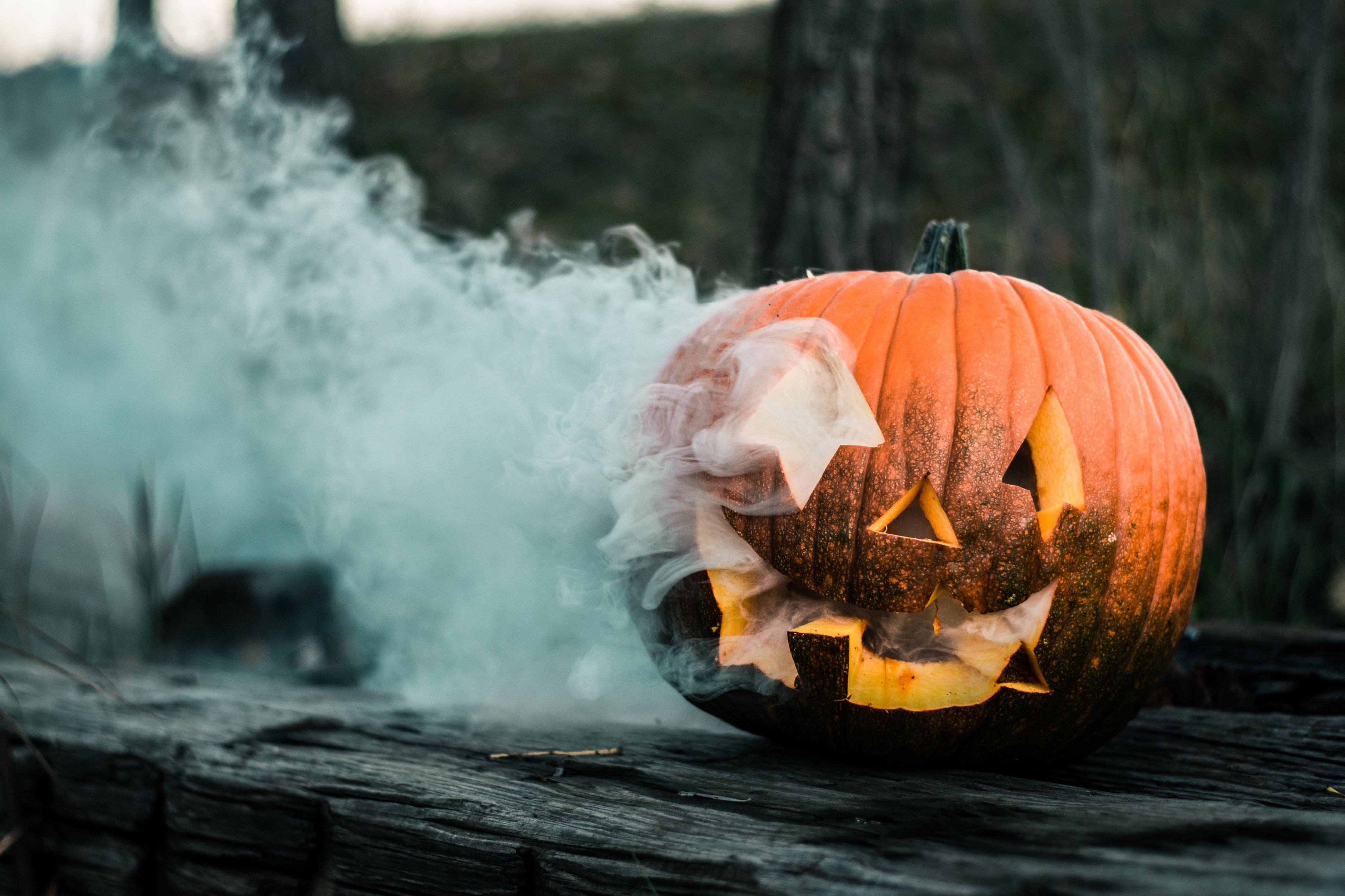 Carved pumpkin with smoke outdoors HD Wallpaper