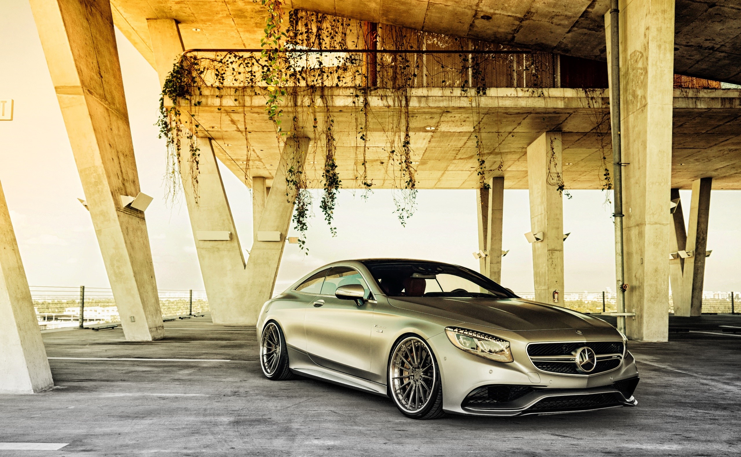 Silver Mercedes-Benz Coupe parked under concrete structure HD Wallpaper