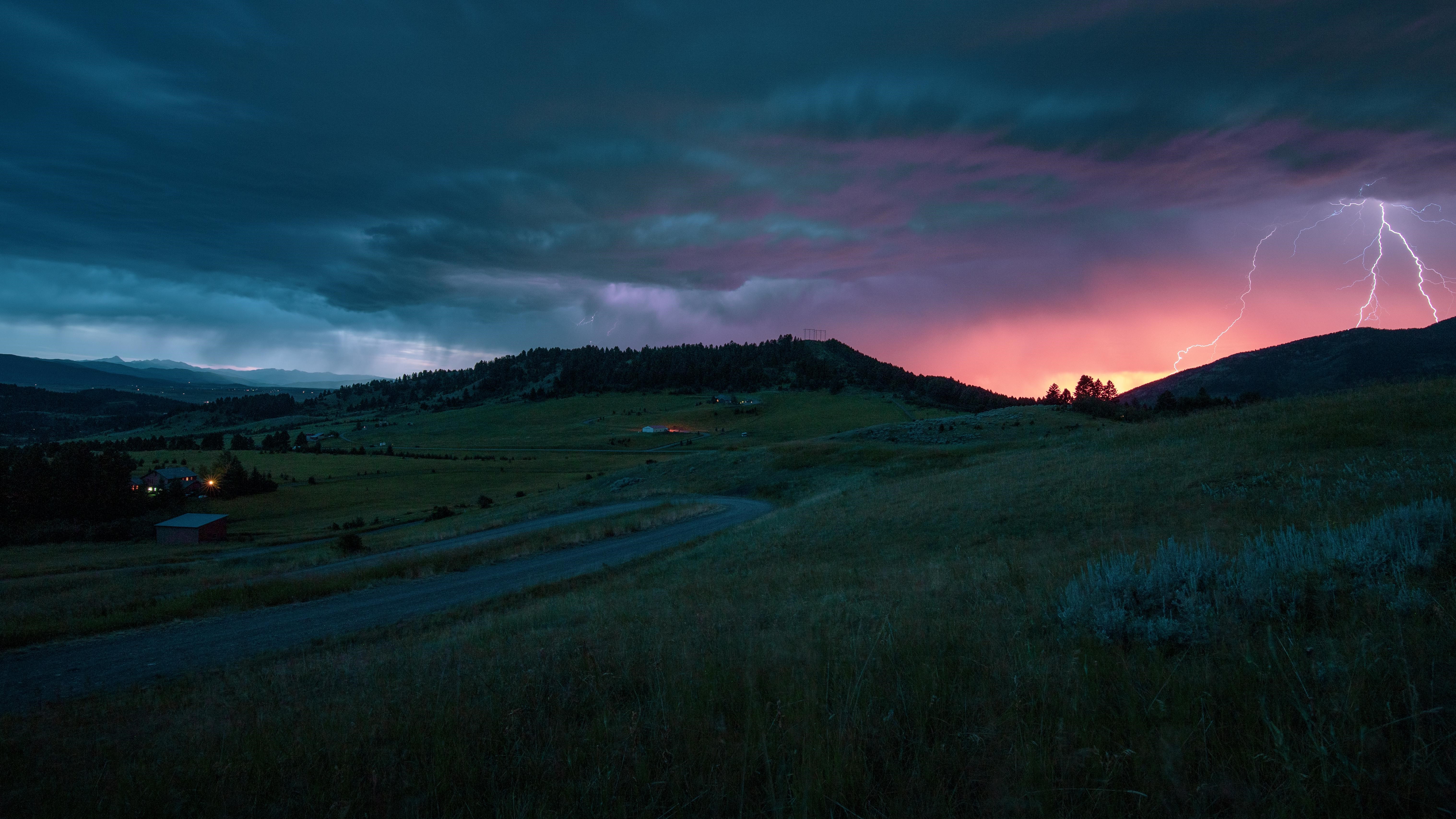 4K lightning storm over rolling hills at sunset HD Wallpaper