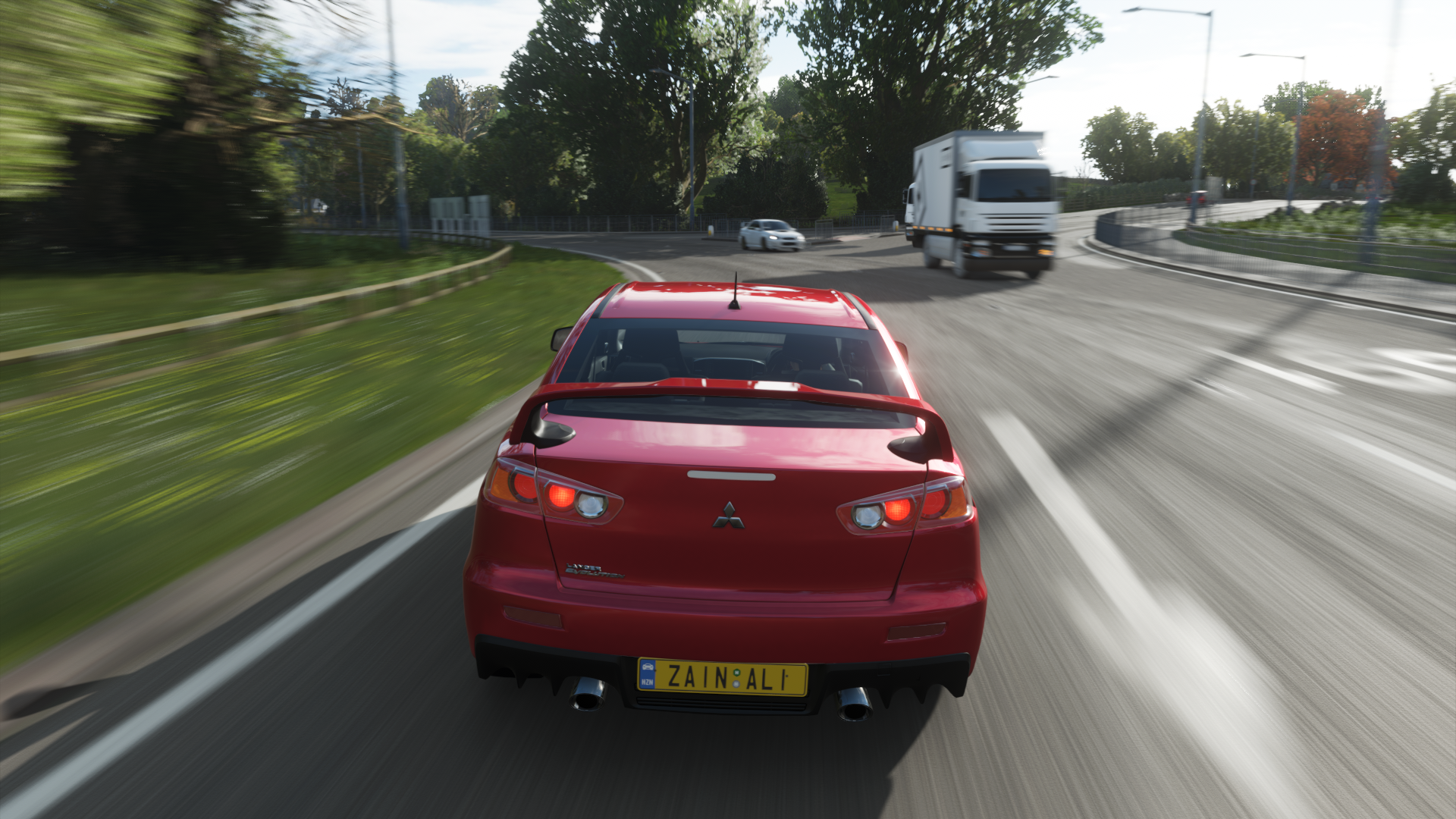 Red Mitsubishi Lancer Evolution X driving on a road HD Wallpaper