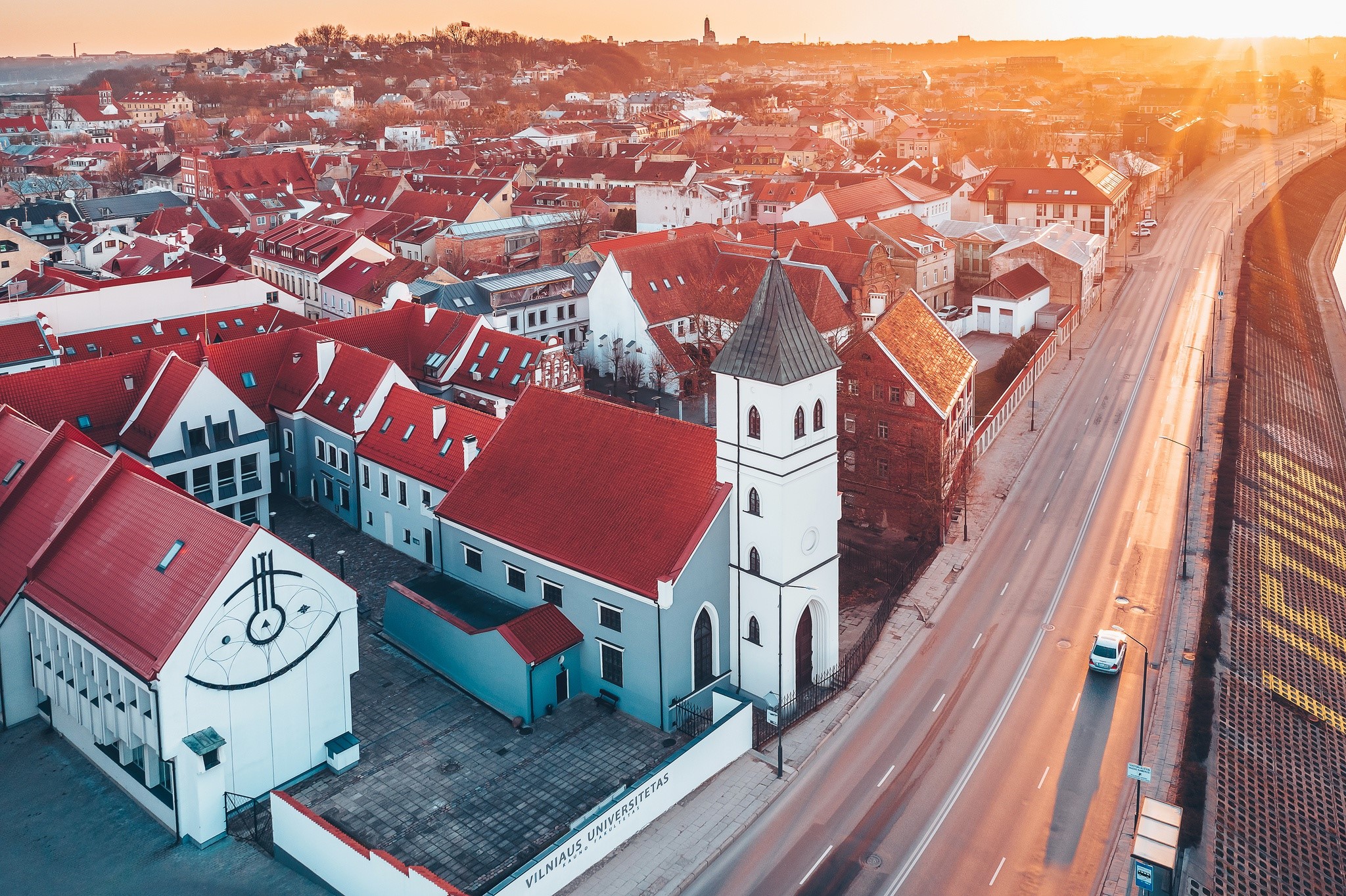 Aerial view of Vilnius University buildings and cityscape at sunset HD Wallpaper