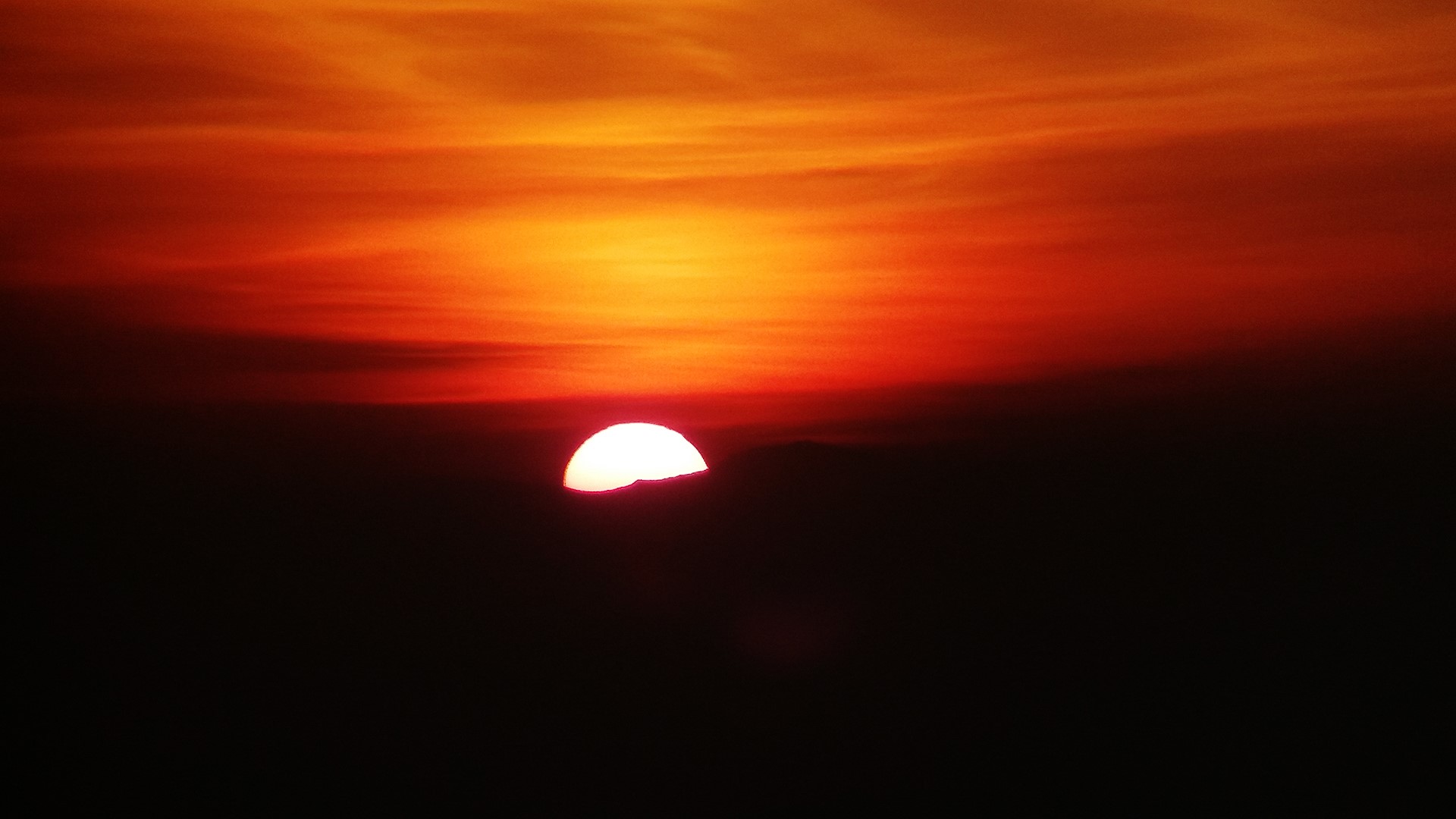 Sunset over dark landscape HD Wallpaper