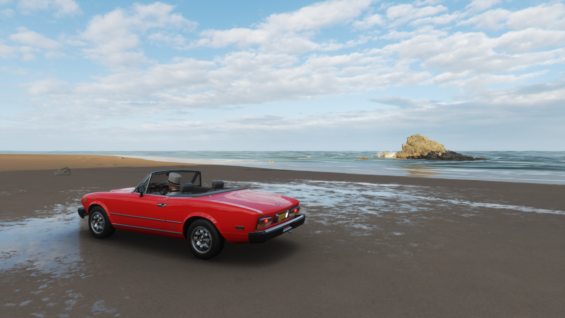 Red convertible car on a beach HD Wallpaper