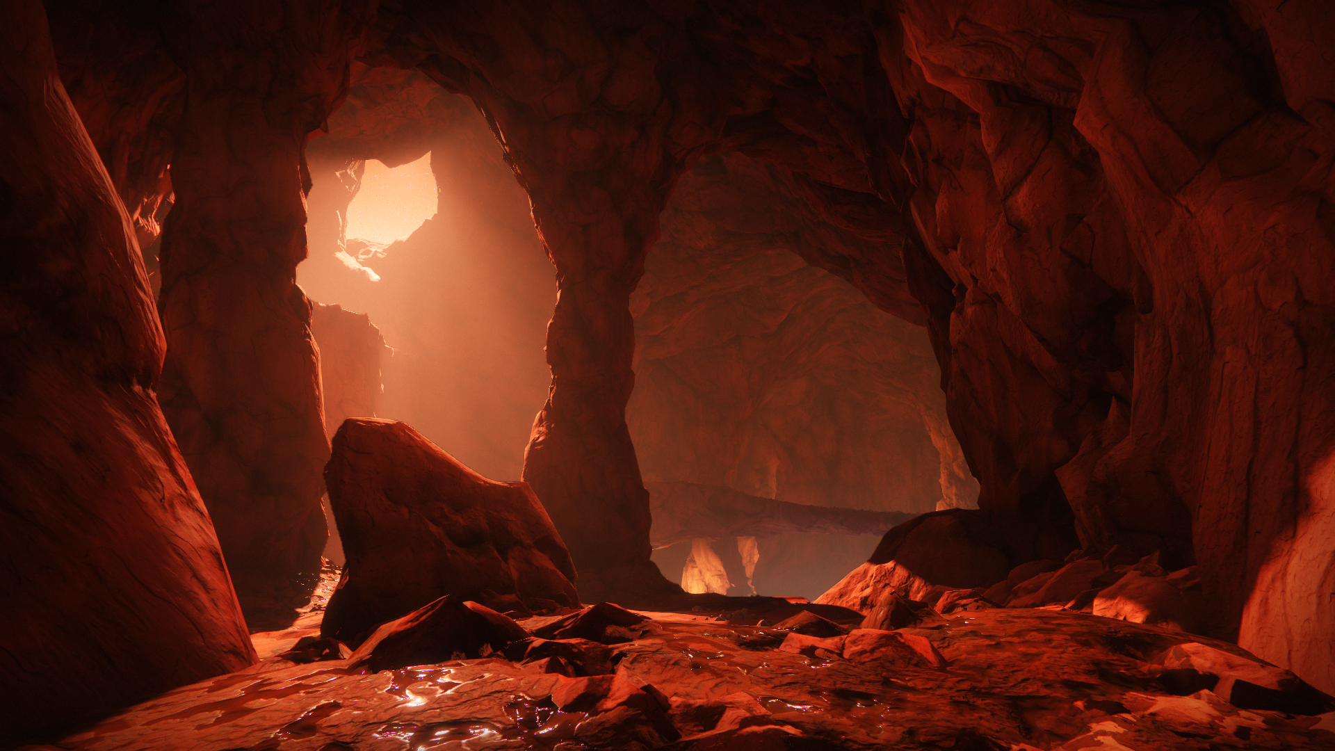 Cave interior with red lighting and rock formations HD Wallpaper