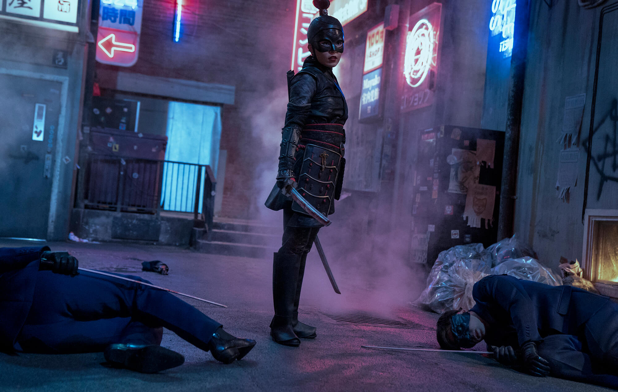 Katana in a neon-lit alley with defeated opponents HD Wallpaper