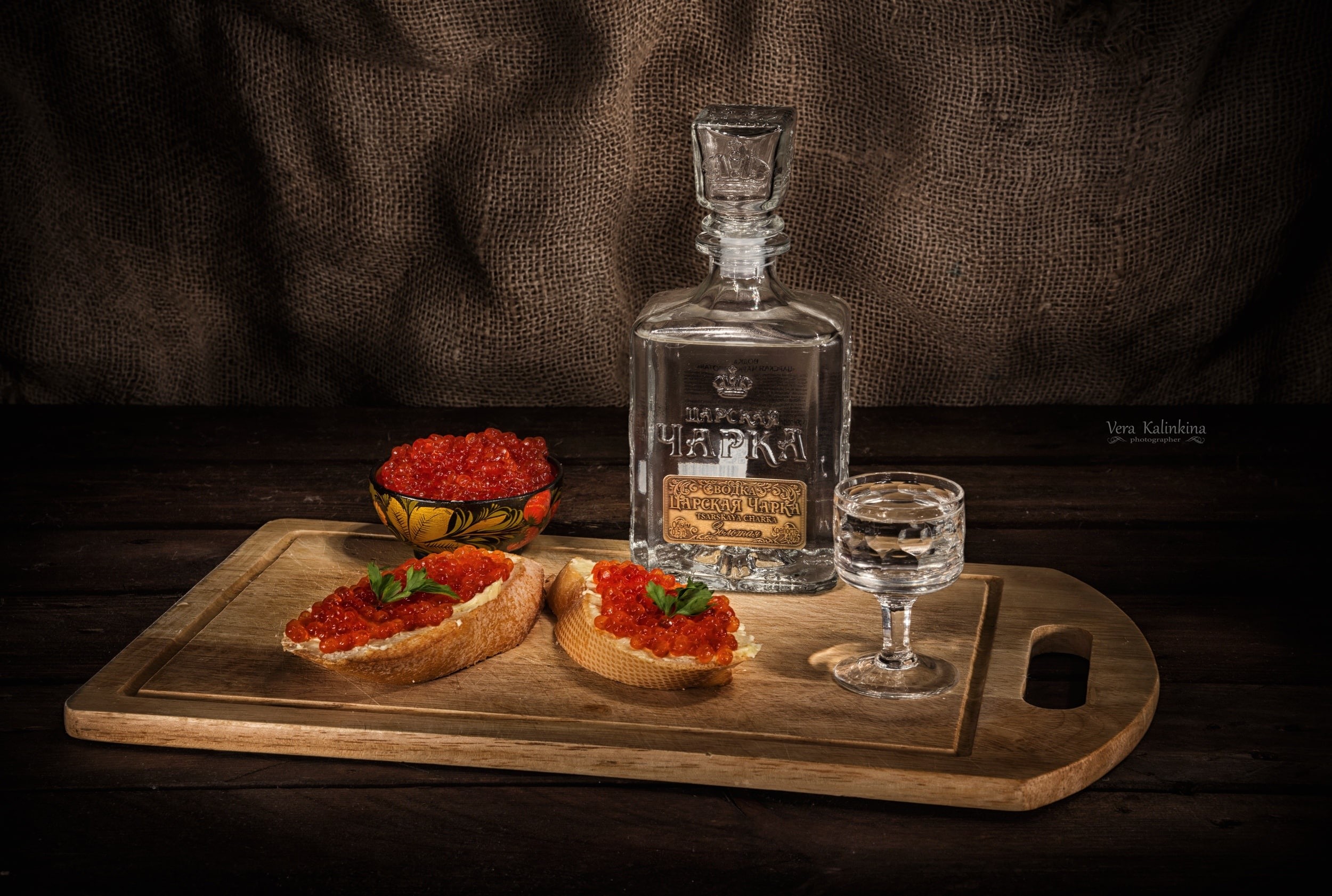 Vodka bottle, shot glass, and caviar on bread HD Wallpaper