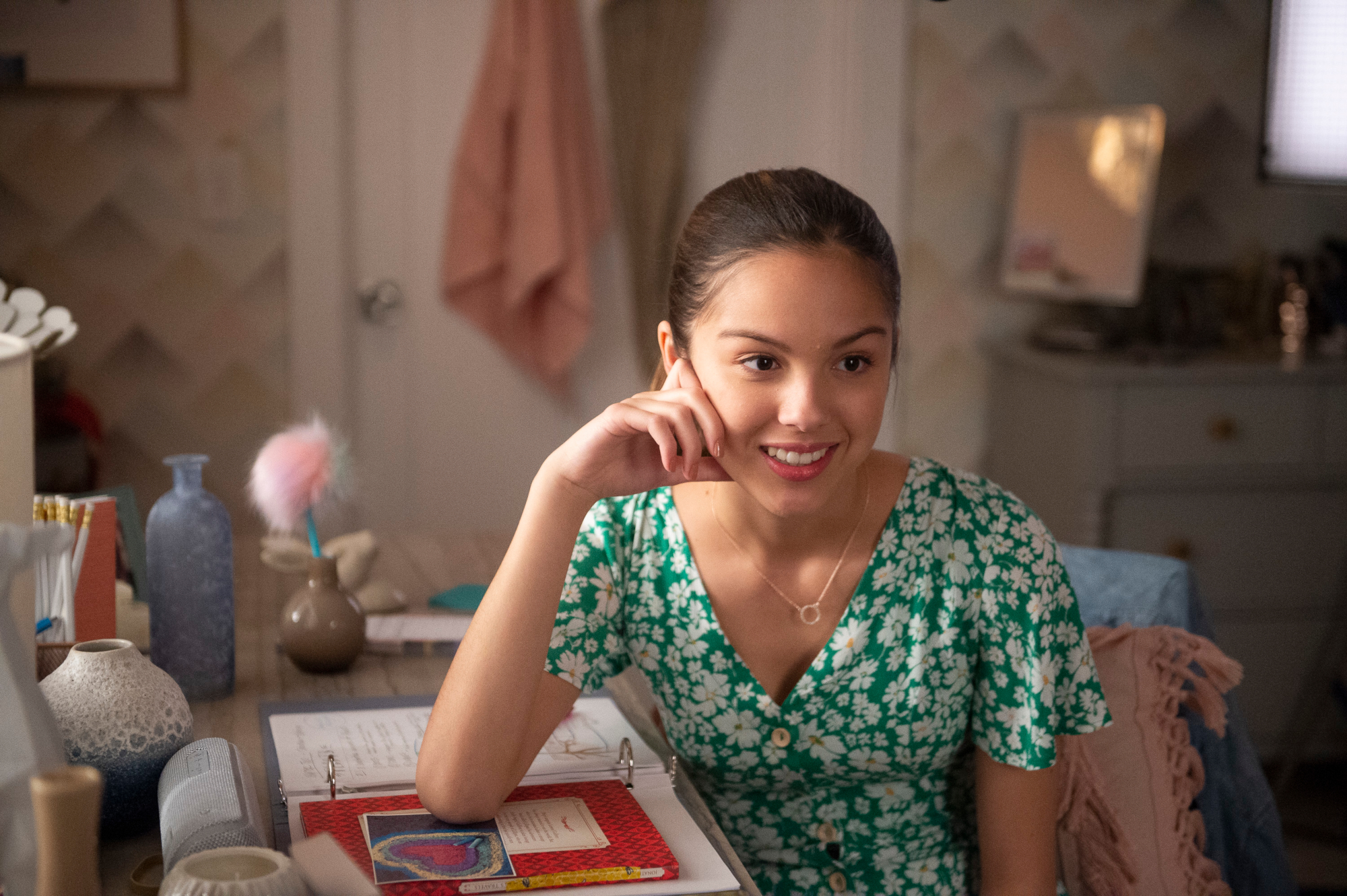 Olivia Rodrigo in a green floral dress HD Wallpaper