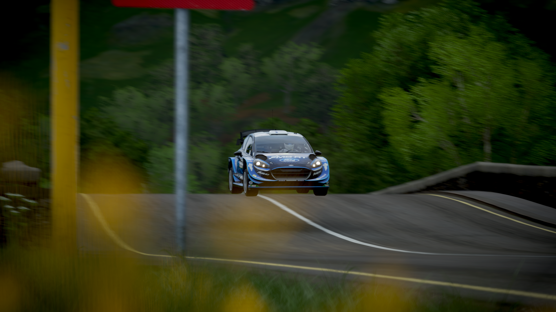 Ford Fiesta RS WRC rally car jumping on a road HD Wallpaper