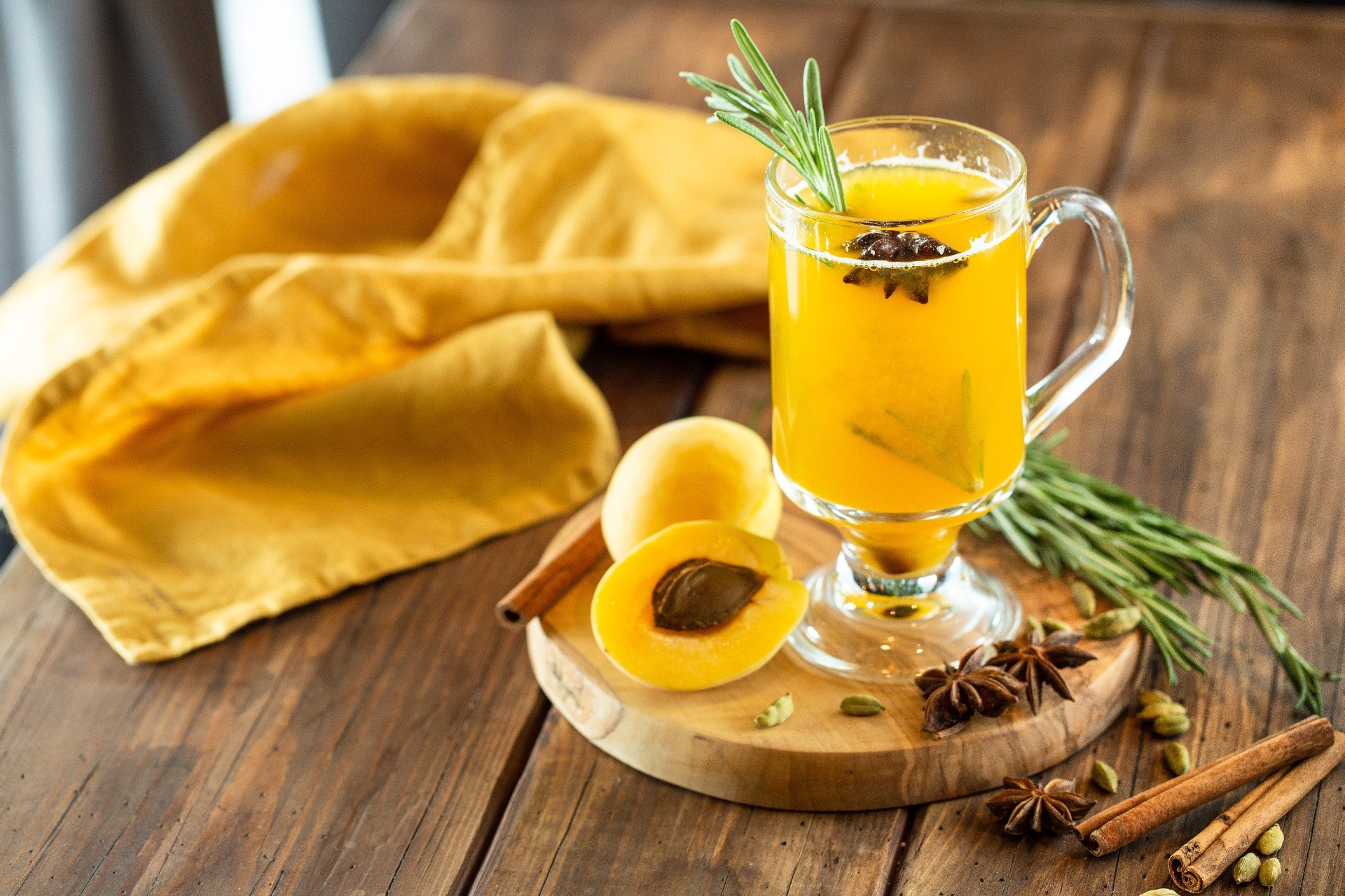 Apricot drink with spices and rosemary HD Wallpaper