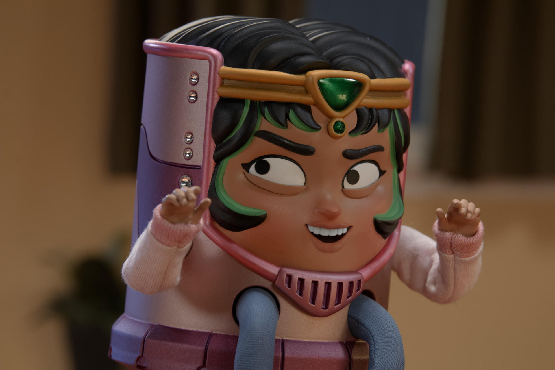 Marvel's M.O.D.O.K. toy with green gem headband HD Wallpaper