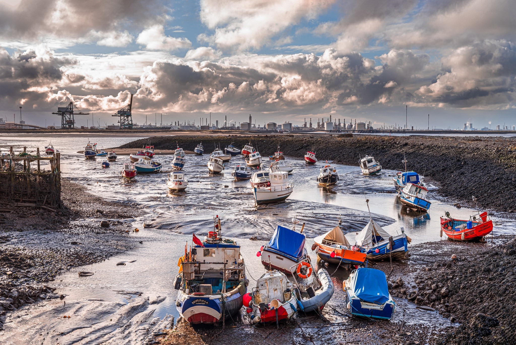 Boats at low tide with industrial background HD Wallpaper