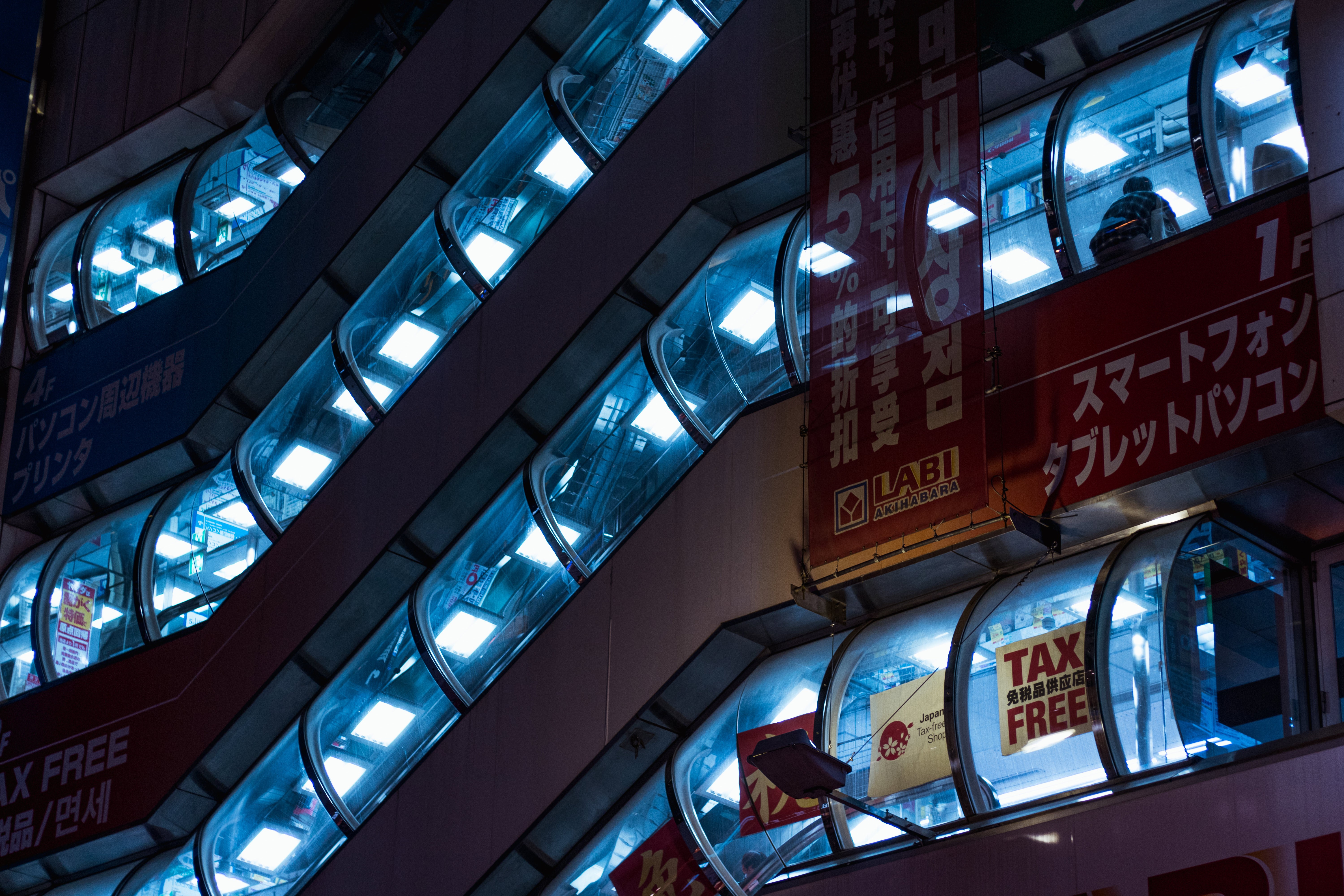 Escalators in a Japanese electronics store at night HD Wallpaper