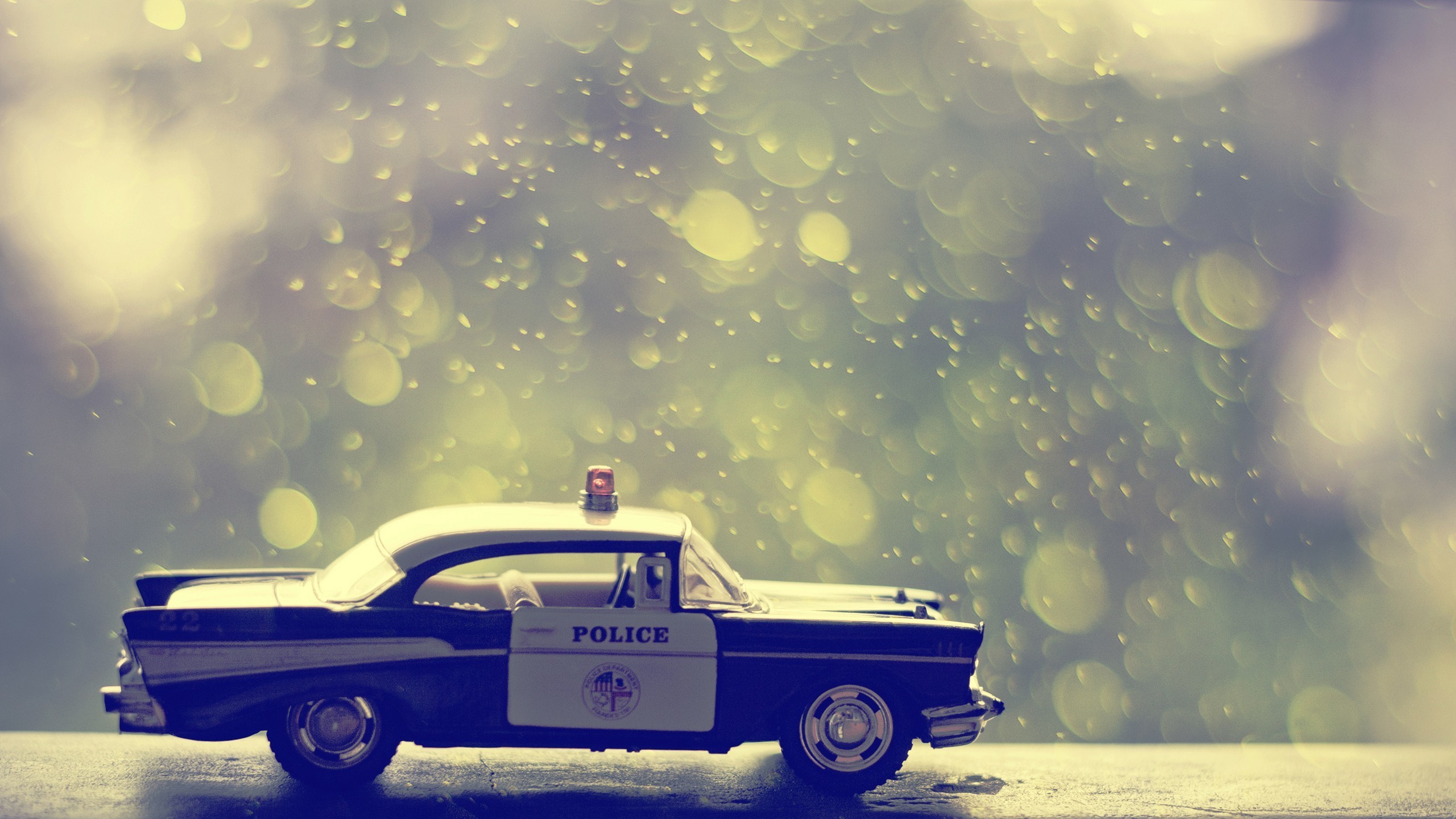 Toy police car with bokeh background HD Wallpaper