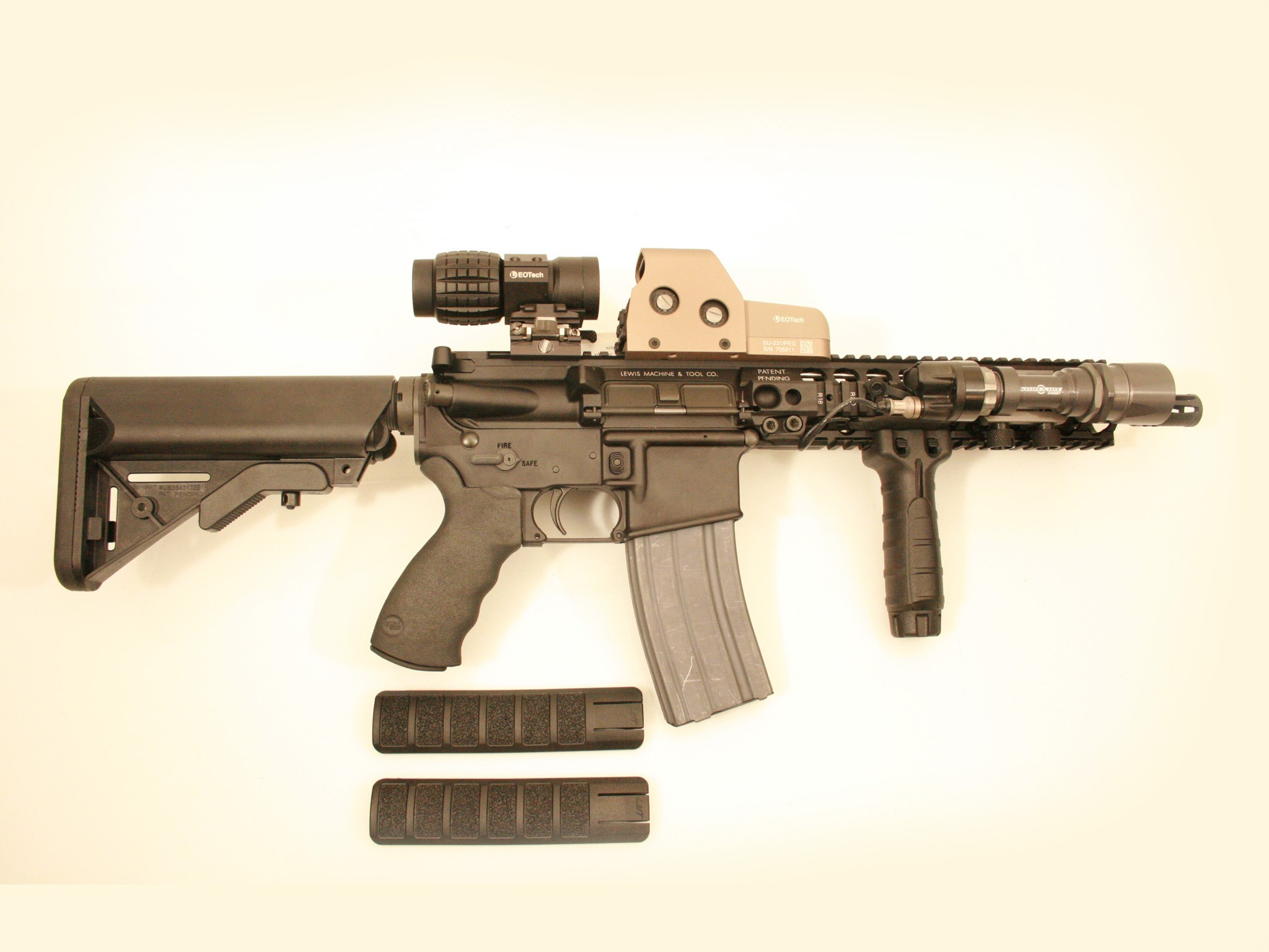 AR-15 style rifle with EOTech sight and tactical light HD Wallpaper