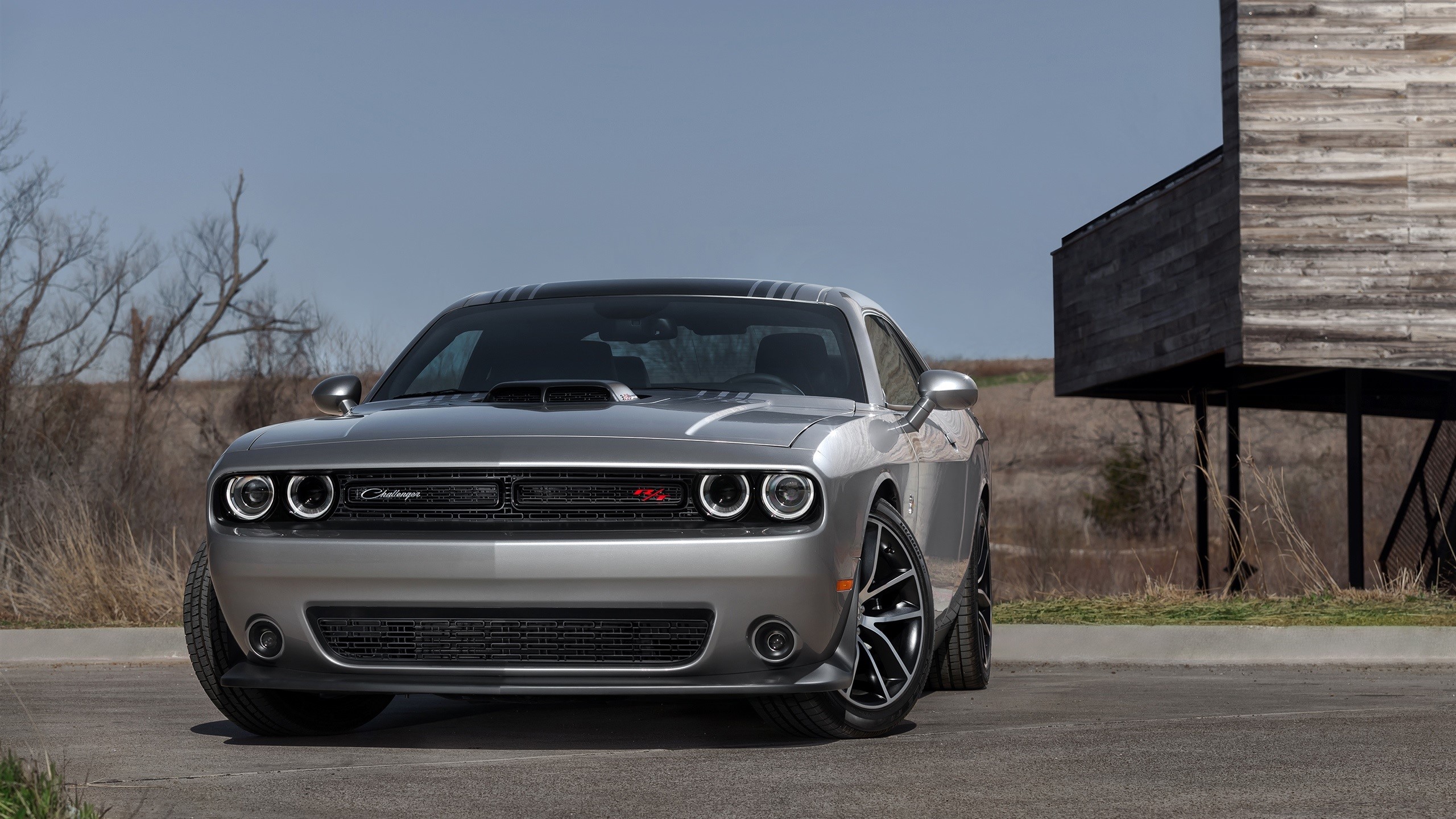 Silver Dodge Challenger R/T parked near a modern building HD Wallpaper