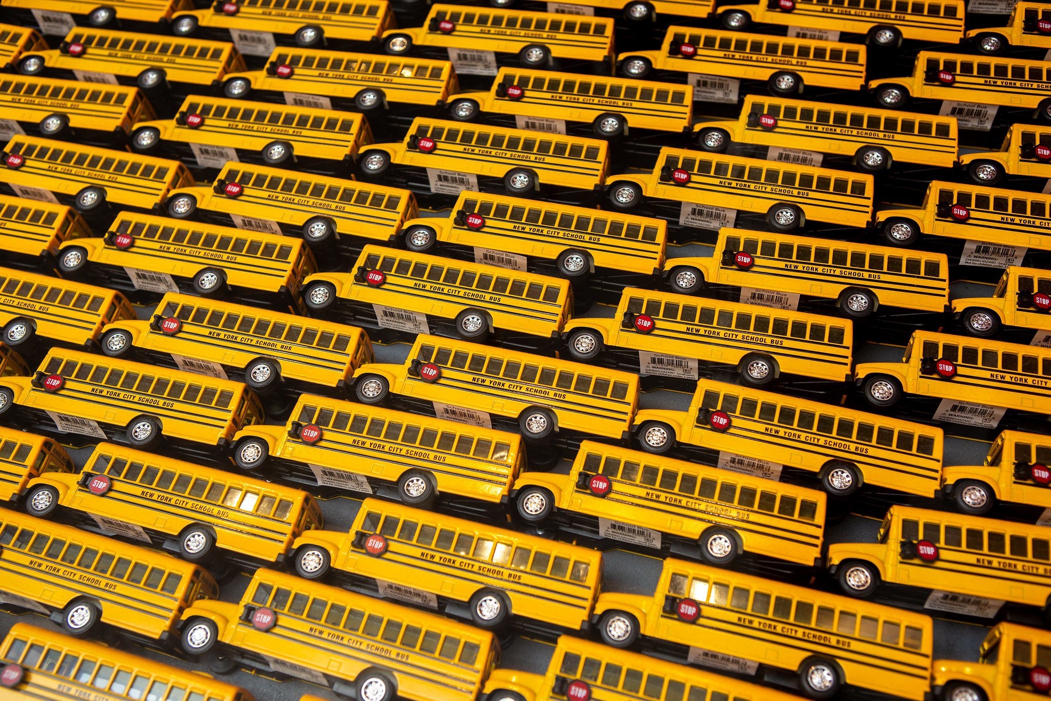 Rows of yellow toy school buses HD Wallpaper