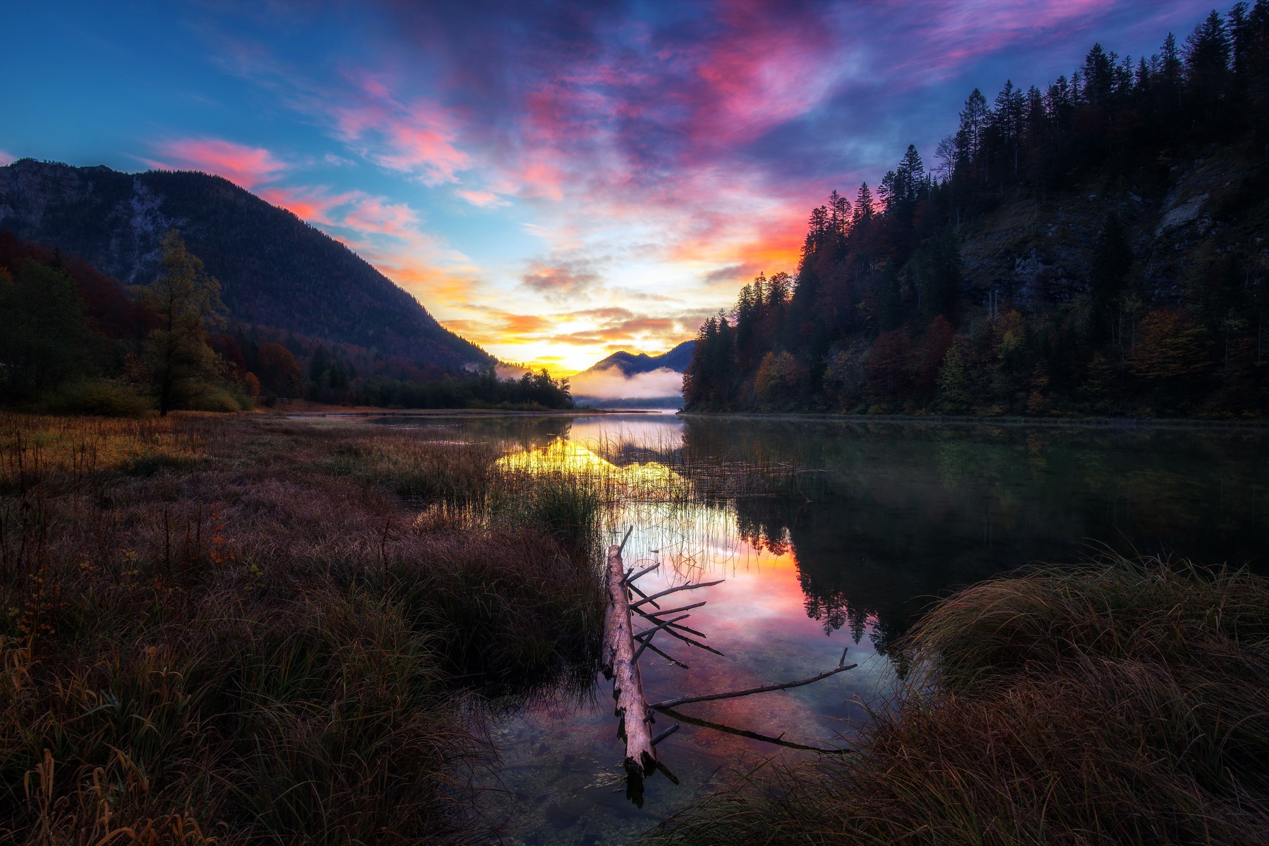 Colorful sunset over a lake with mountains and trees HD Wallpaper