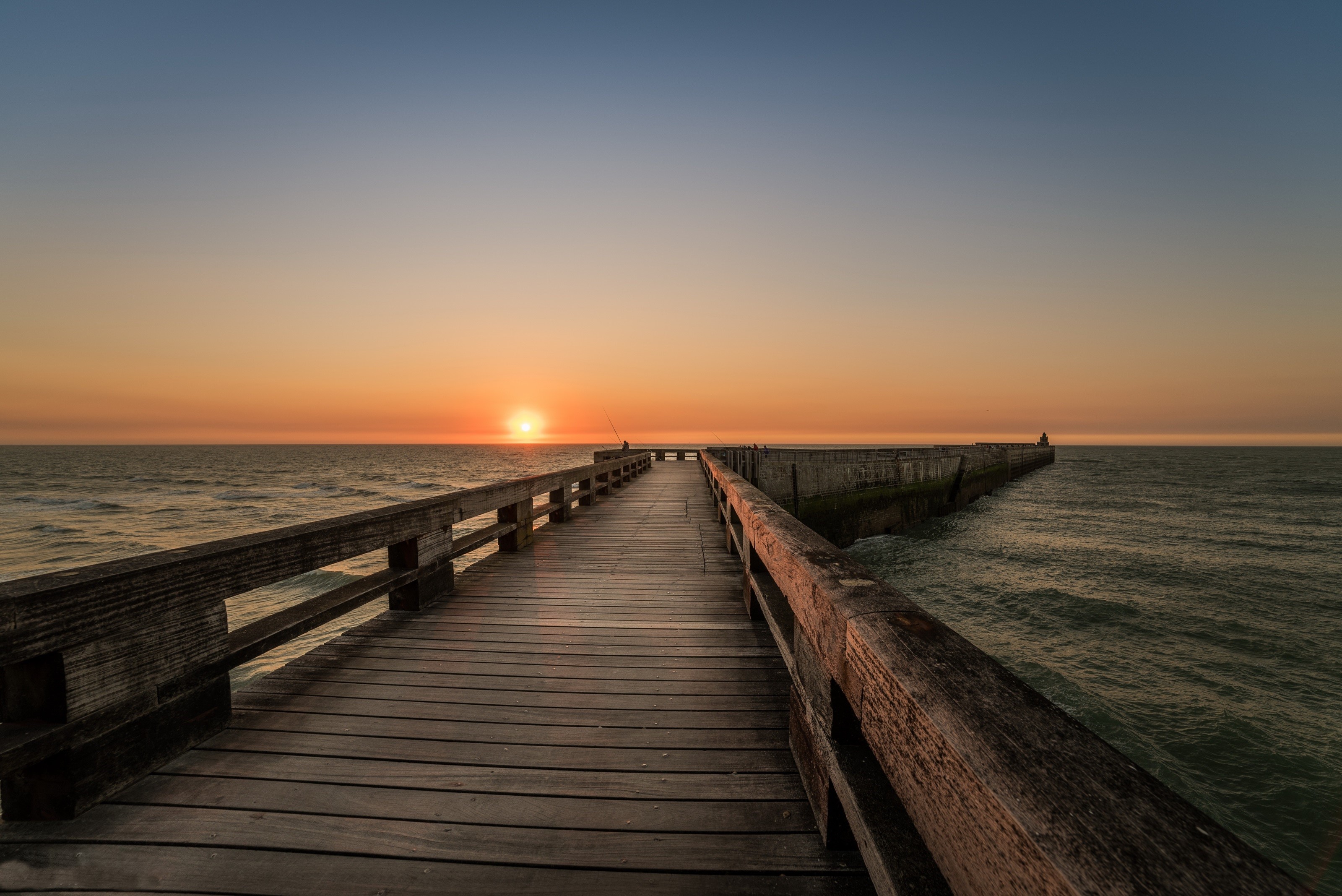 Wooden pier at sunset over the sea HD Wallpaper