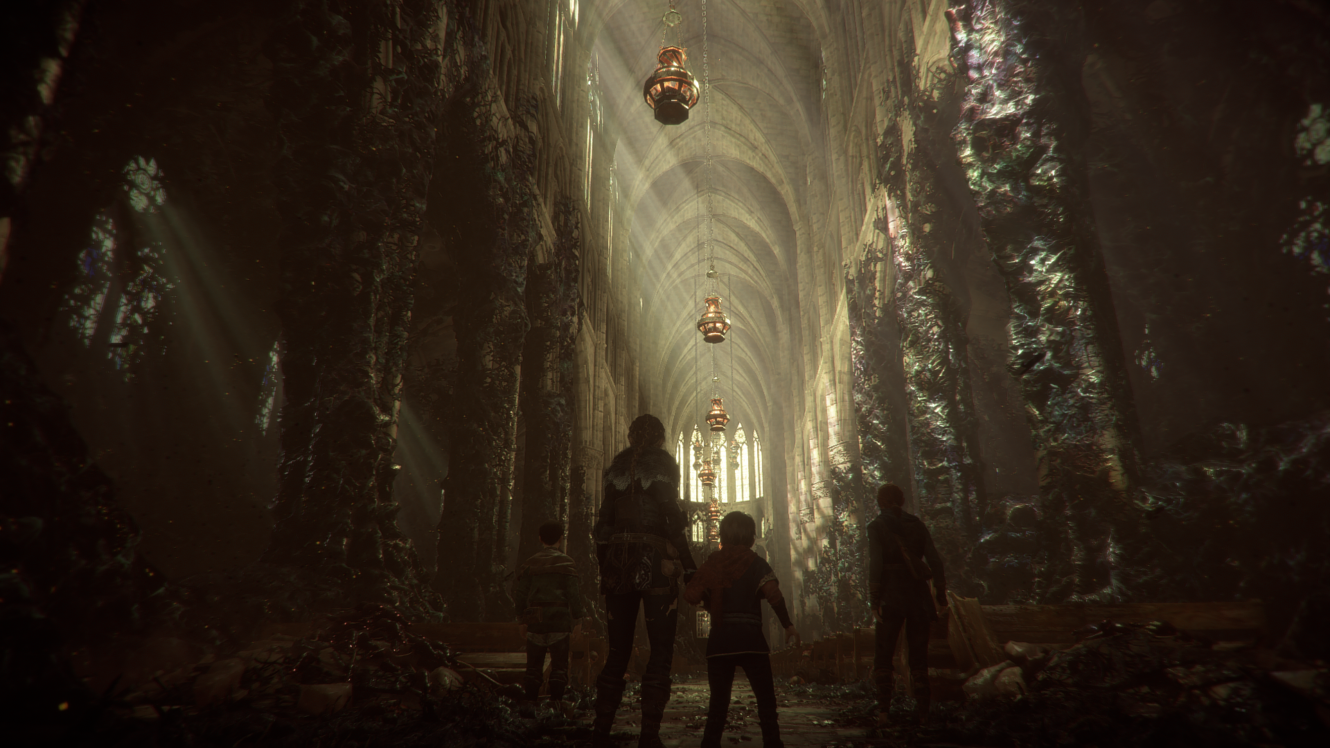 Amicia and companions in a ruined cathedral in A Plague Tale Innocence HD Wallpaper