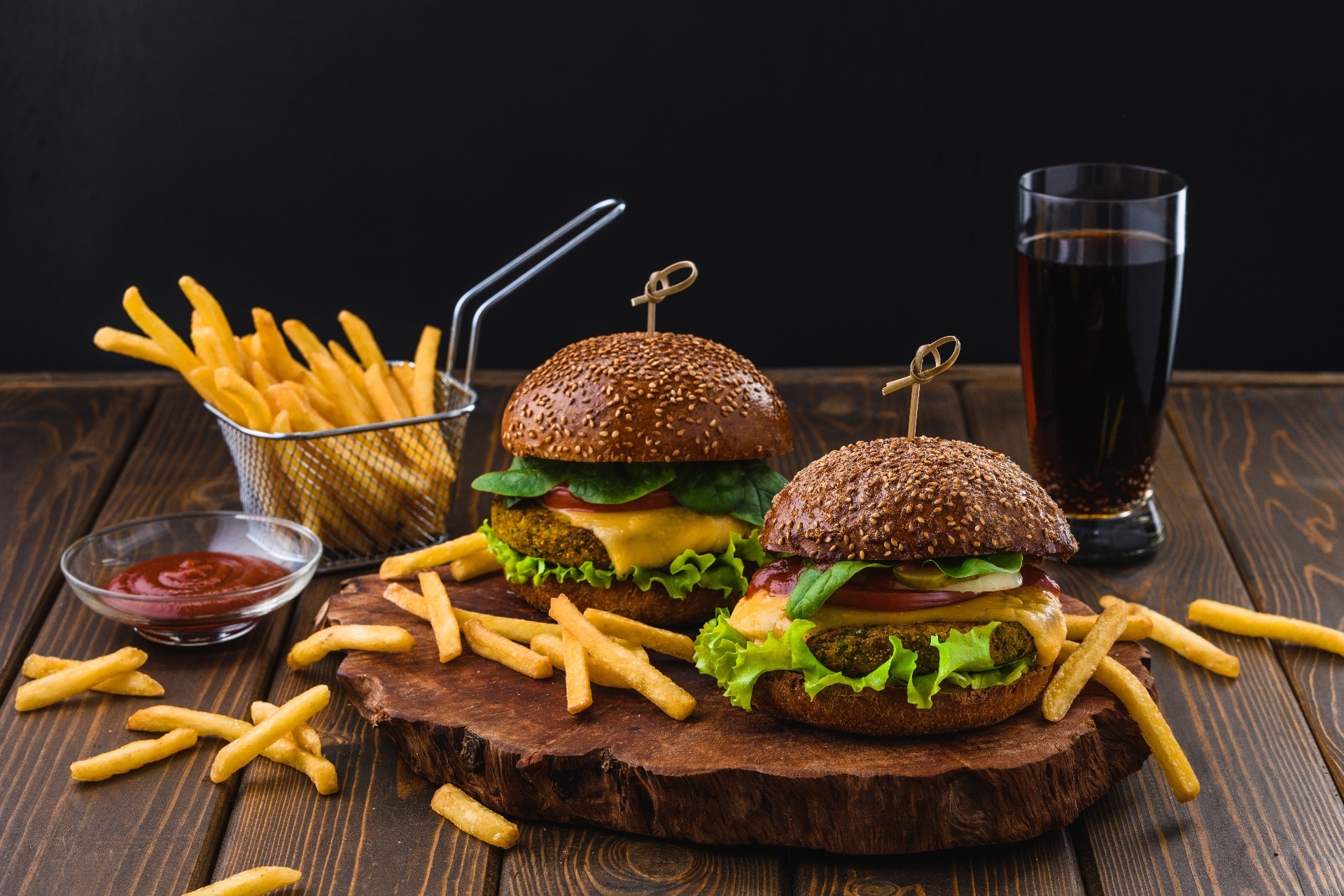 Two veggie burgers with fries and ketchup HD Wallpaper