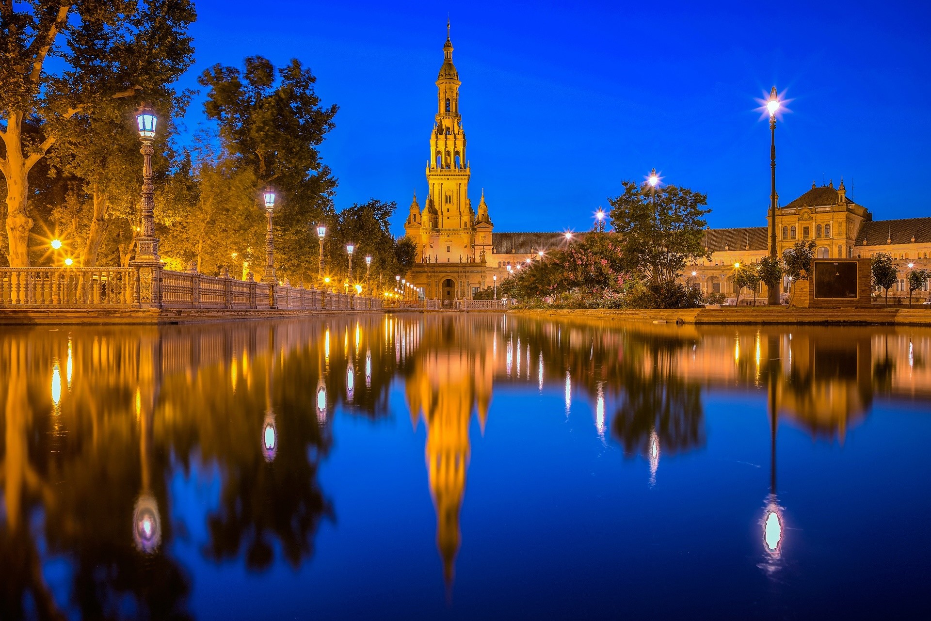 Plaza de España in Seville, Spain at dusk with reflections HD Wallpaper