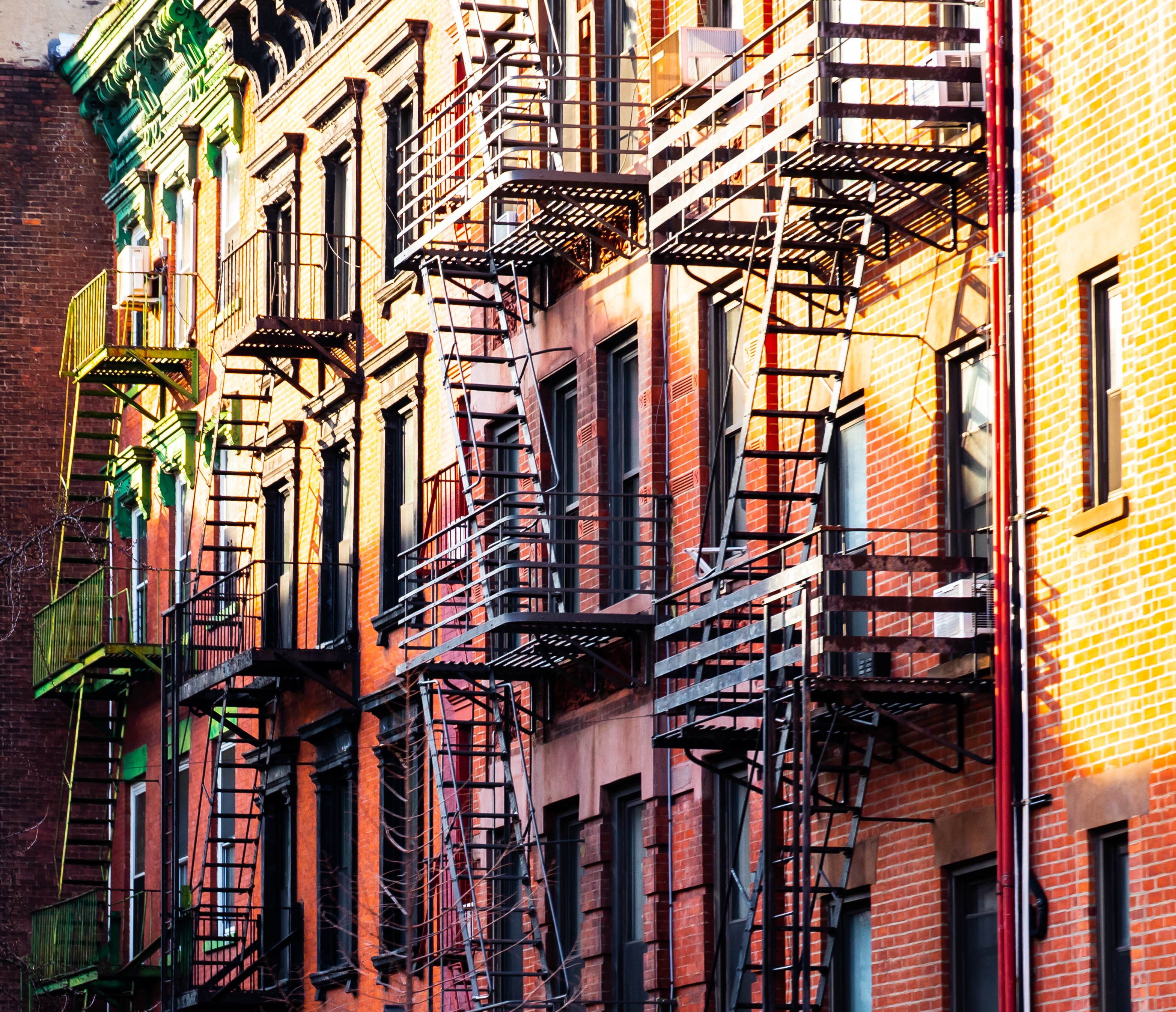 New York City apartment buildings with fire escapes HD Wallpaper